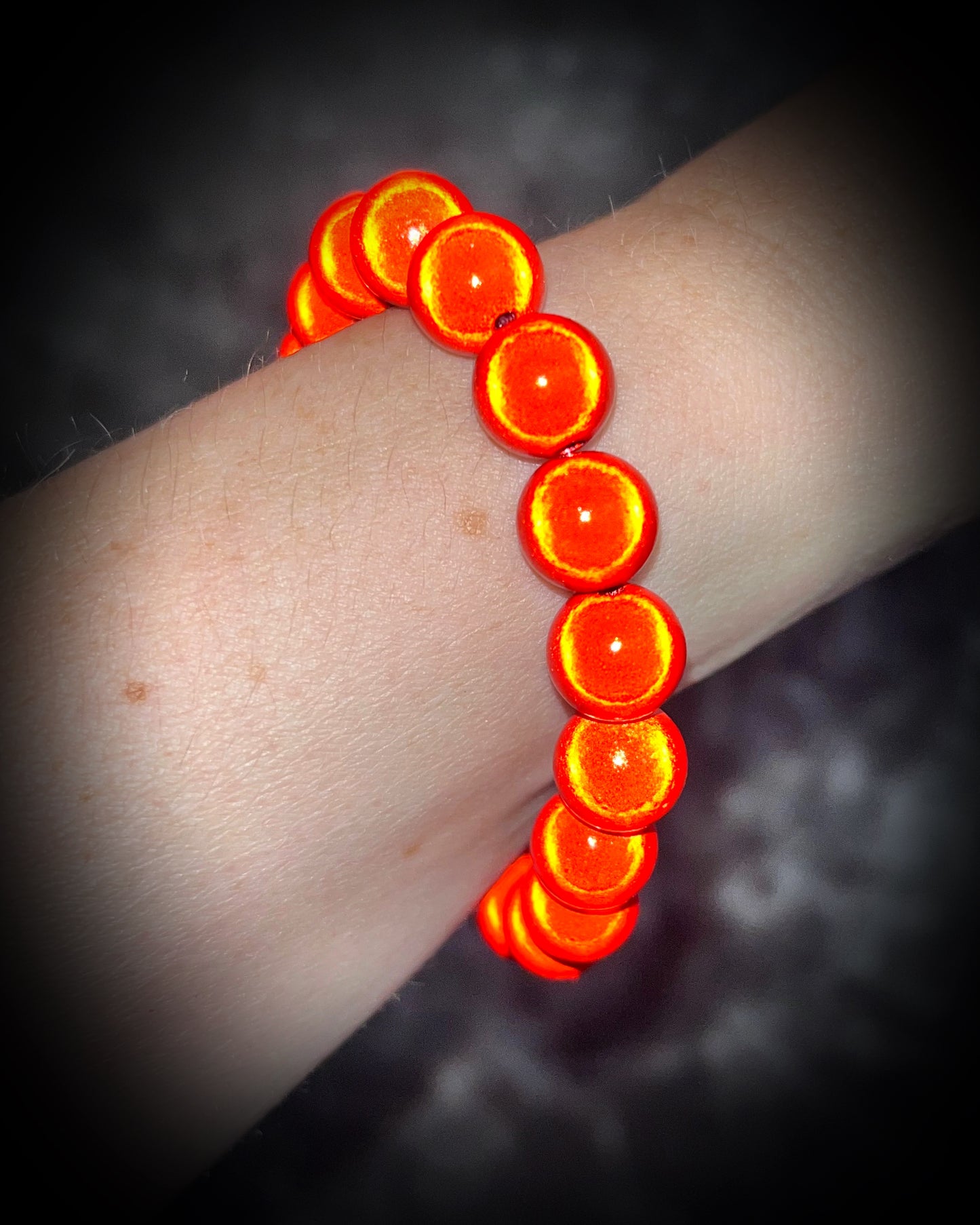 Colorful Eclipse bracelets from Become Spellbound! Magical illusion bracelets for stacking, parties, summer jewelry, festivals, raves, travel jewelry and more! Gift for her, fire red orange beaded bracelet.