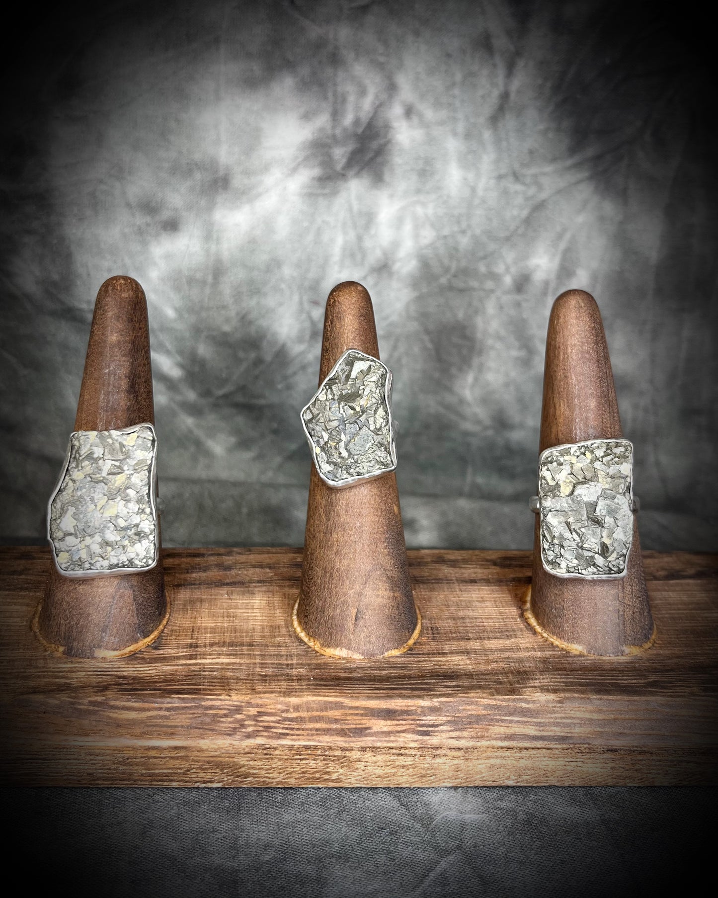 A sterling silver raw gemstone statement cocktail ring featuring a dazzling pyrite crystal. Manifest your dreams and protect your energy with style.