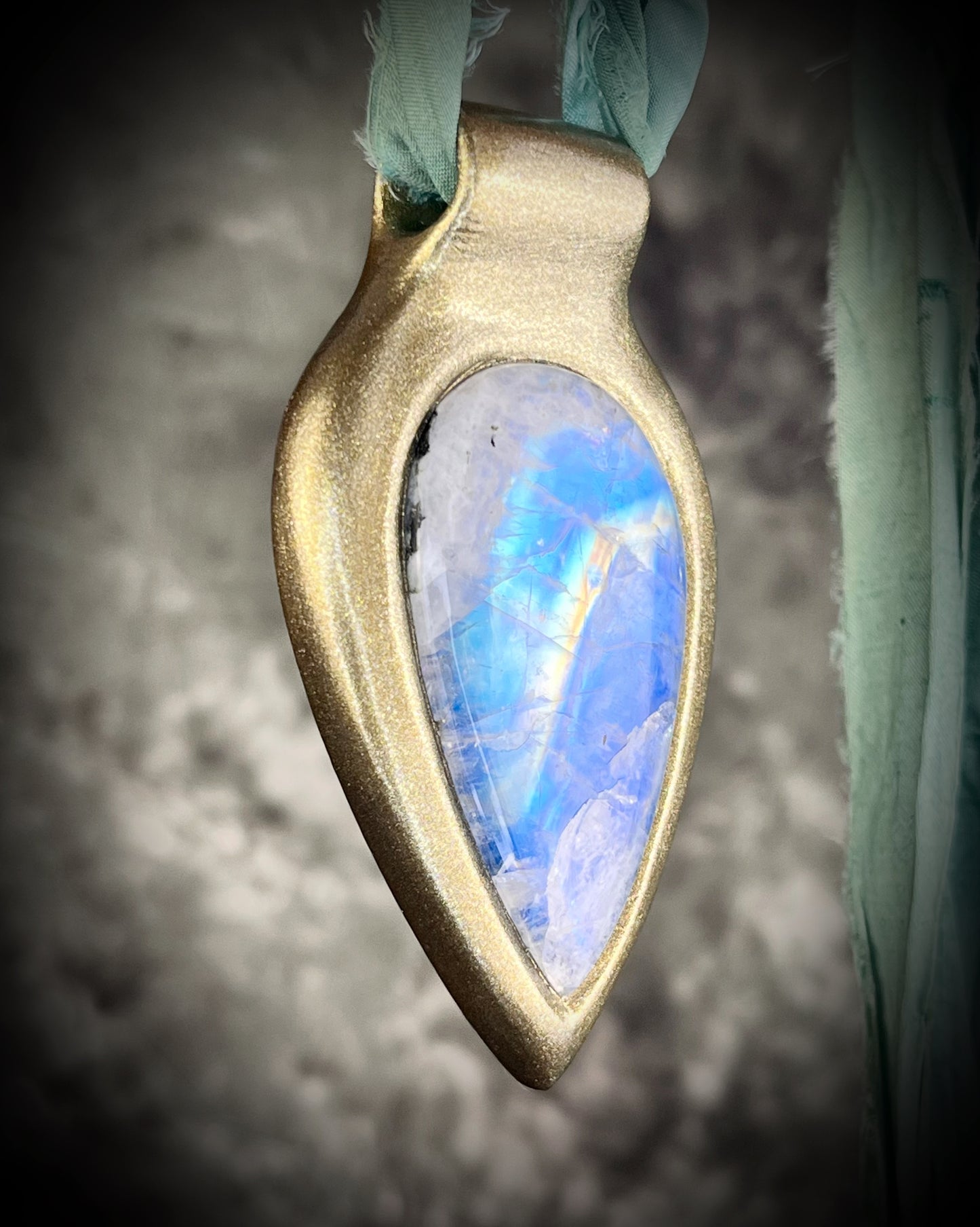 Handmade in the USA sculptural one of a kind statement, maximalist Rainbow Moonstone Necklace. Goddess inspired and hung from recycled silk for a modern eco-friendly gift!