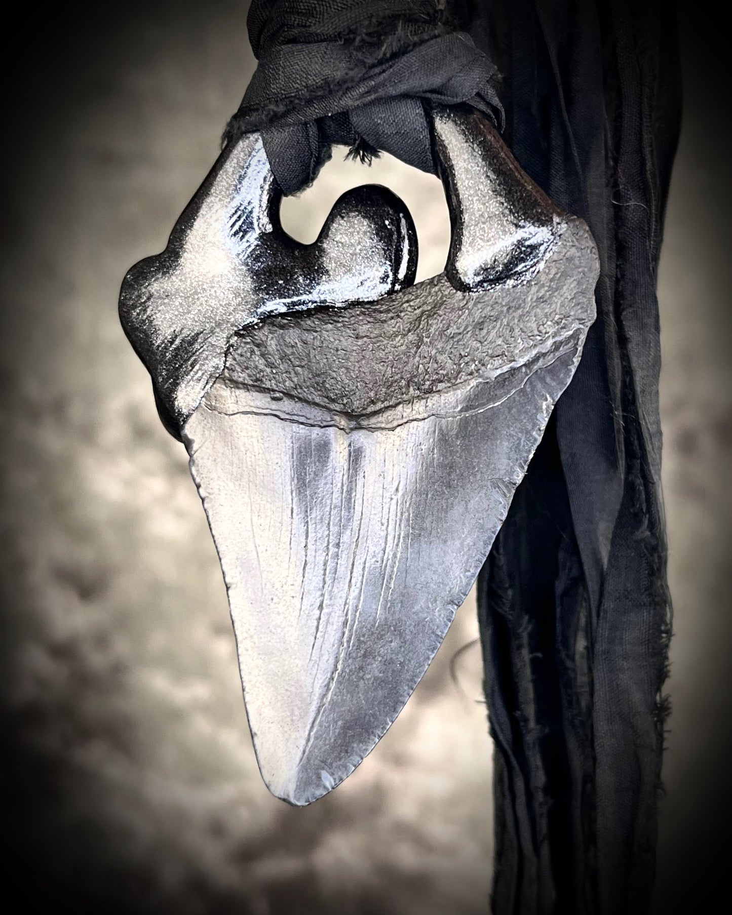 Dark Queen inspired handmade gemstone encrusted megalodon fossil tooth necklace. This talisman serves to ground and protect and would be at home on a fantasy film set or a birthday cosplay costume! Made in the USA on recycled silk for eco-friendly dark luxury.