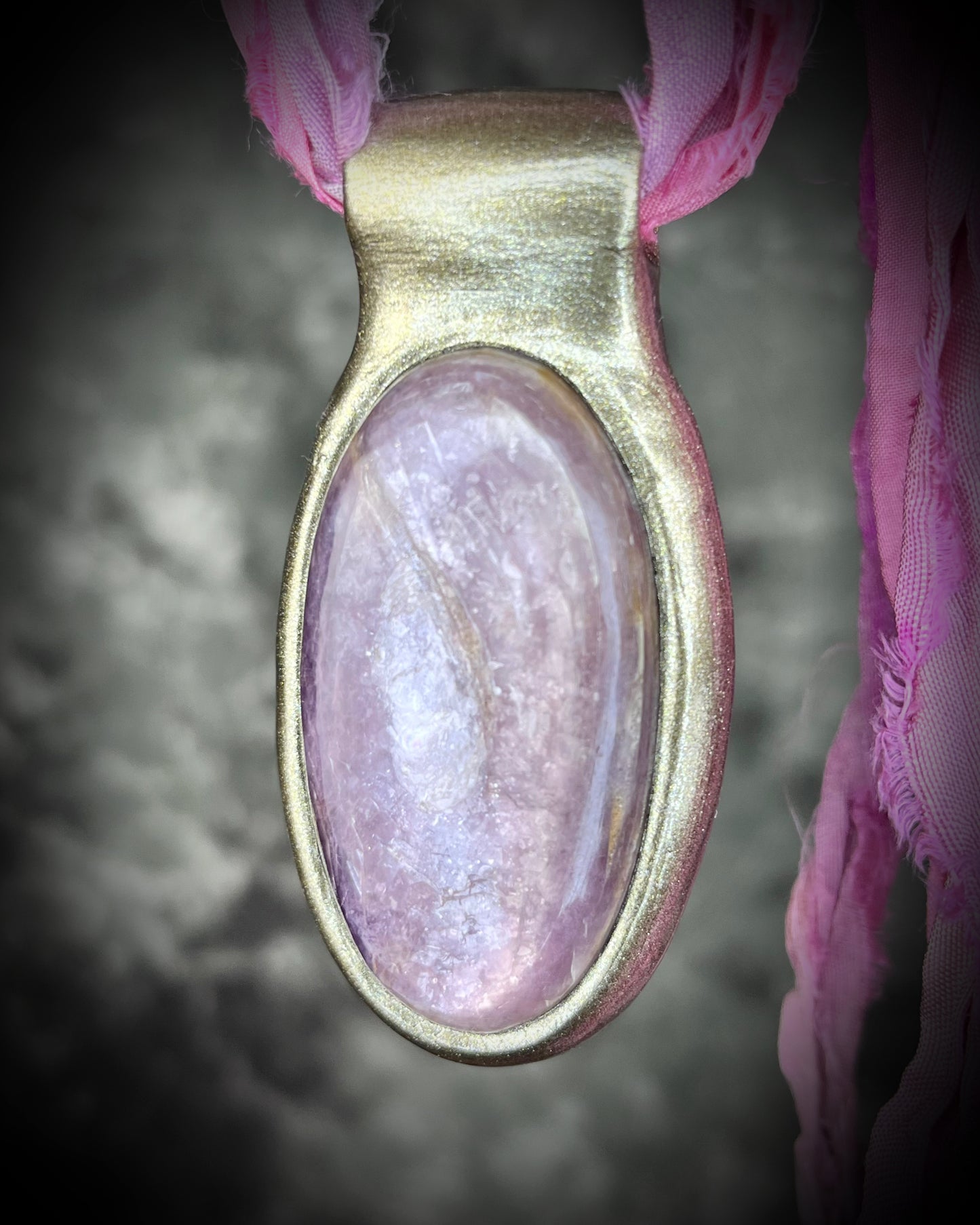 Handmade designer anti-anxiety crystal lepidolite raw stone necklace in gold finish. This gemstone pendant is hung from recycled silk, sustainable and perfect for summer or travel jewelry!