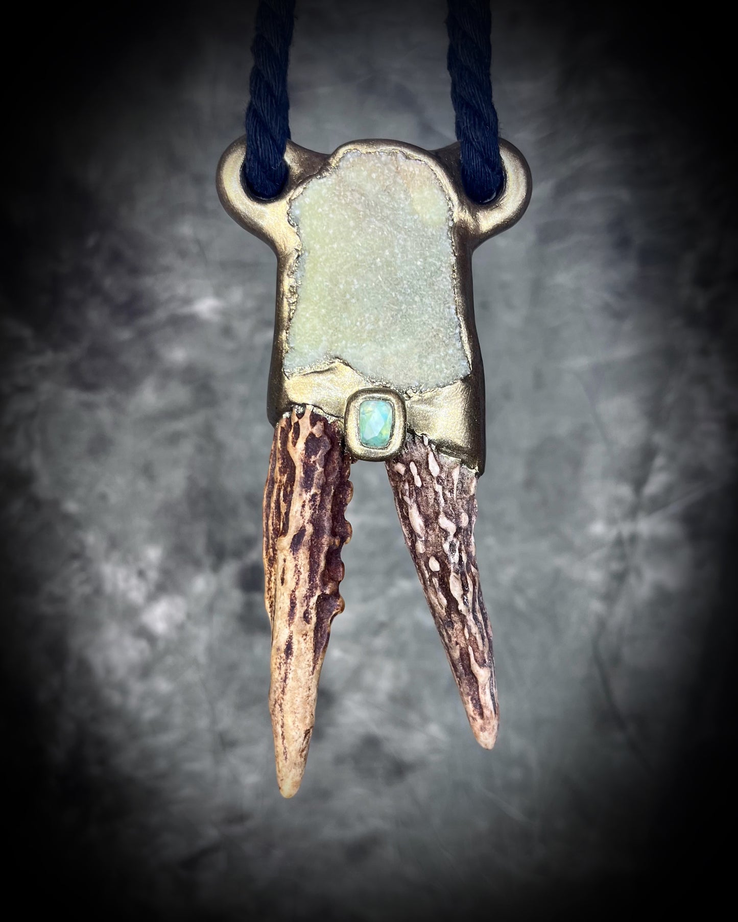 Shamanic jewelry for the boho spirit! Handmade antler, prehnite heart chakra crystal and green tourmaline healing gemstone talisman. Call your spirit guides with this eco-friendly pendant hung from recycled silk.