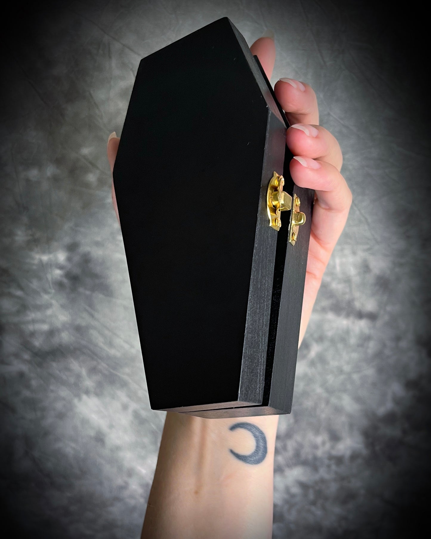 Black wood coffin mystery boxes featuring handmade skull necklaces and crystal healing bracelets. Halloween blind box gift for her.