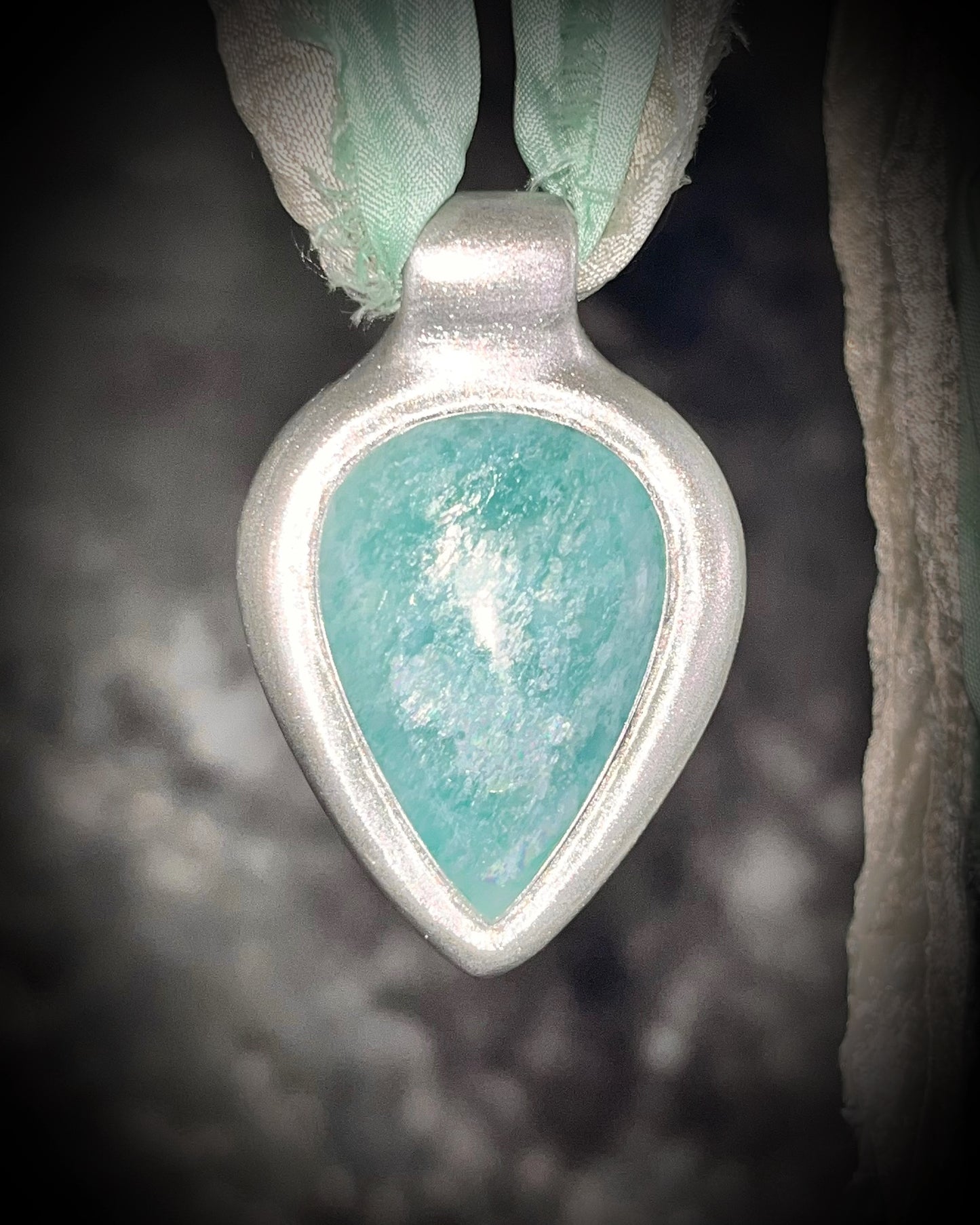 Amazonite handmade crystal healing gift for calm and balance. Silver teardrop gemstone necklace hung from recycled silk for summer, festival, travel, pregnancy jewelry or boho everyday magic.