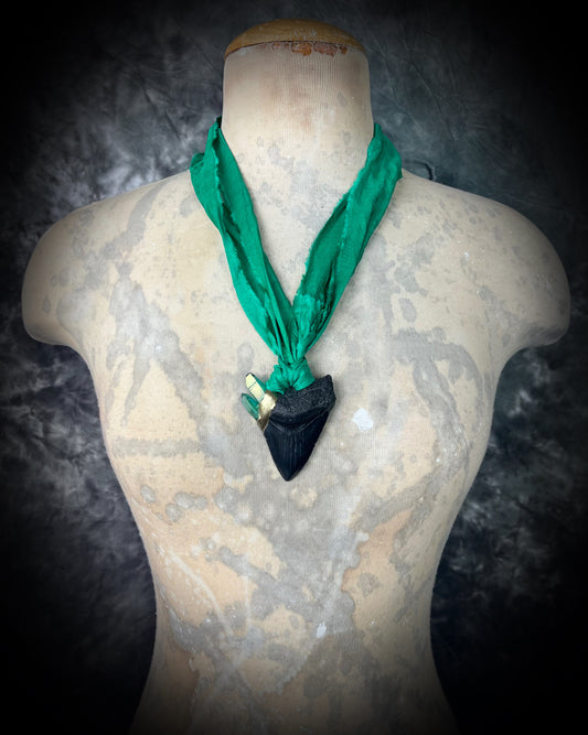 Ancient megalodon fossil tooth necklace with green aura quartz points. Gemstone fantasy jewelry for the wild-hearted and fearless. Green recycled silk jewelry gift for her holiday 2025.