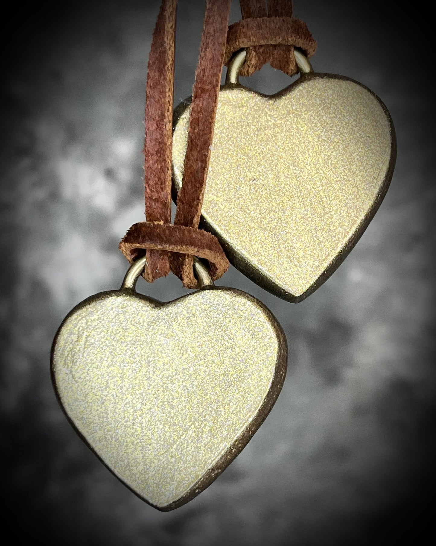 Back view of Tiger’s Eye crystal heart pendant necklaces with gold finish on brown leather cord — handmade grounding and protective jewelry. Holiday gift for her.
