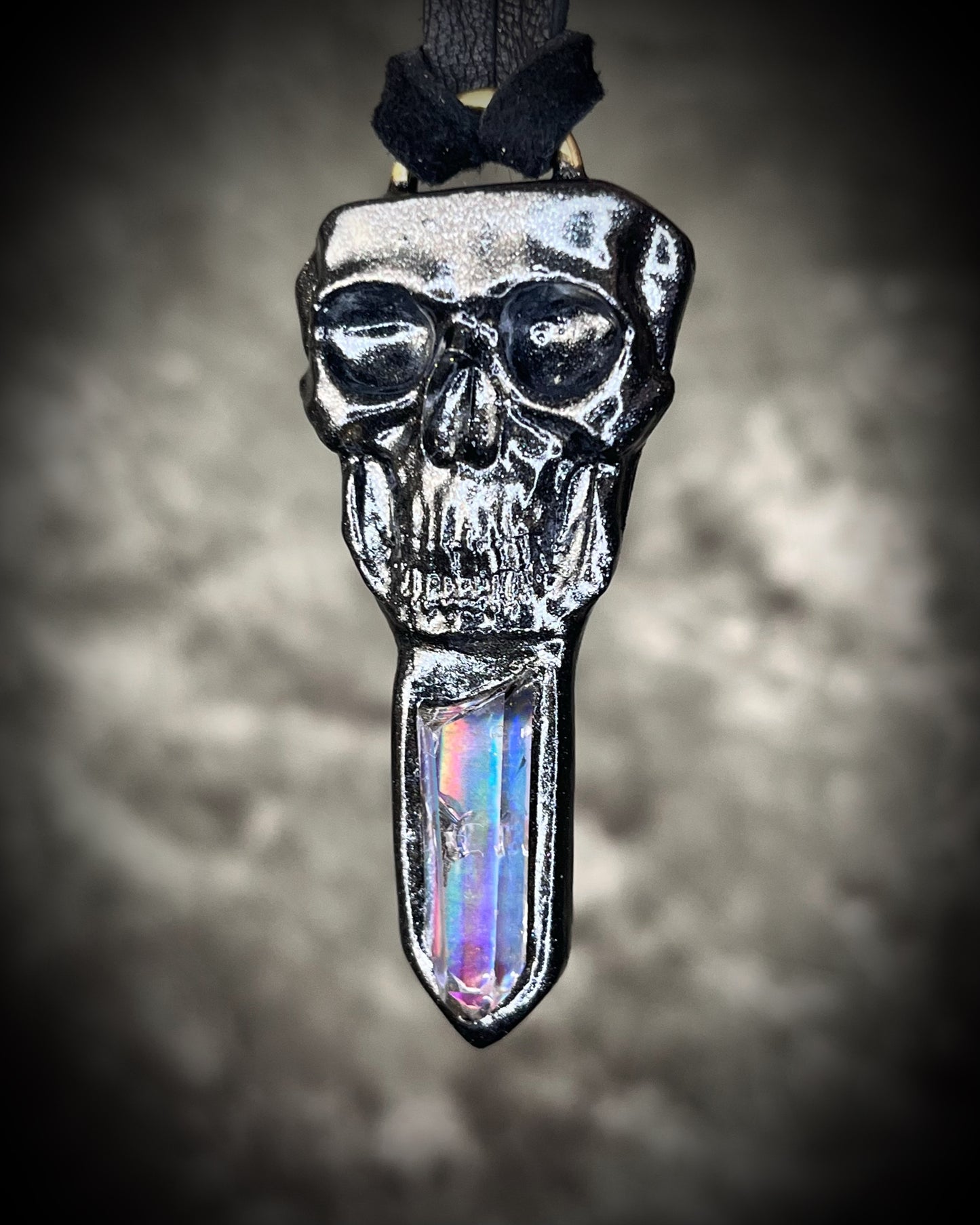 Black rainbow quartz crystal skull necklace on black leather