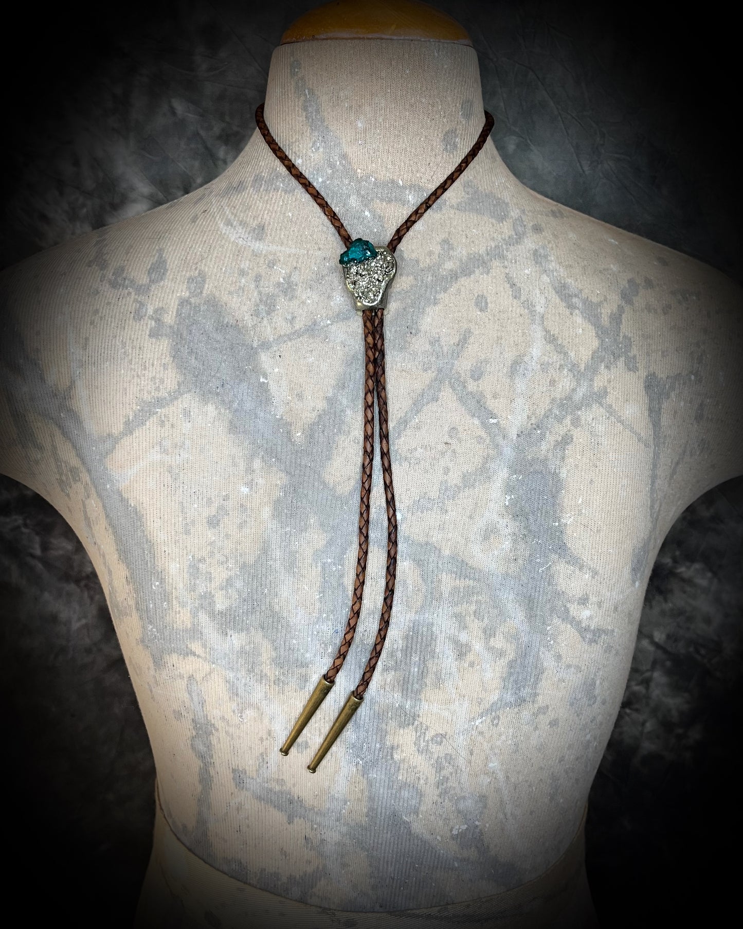 Chunky Pyrite and Dioptase crystal bolo tie on brown leather – unique handmade bolo necklace, artisan gemstone bolo tie jewelry, mystical men’s bolo for bold style.