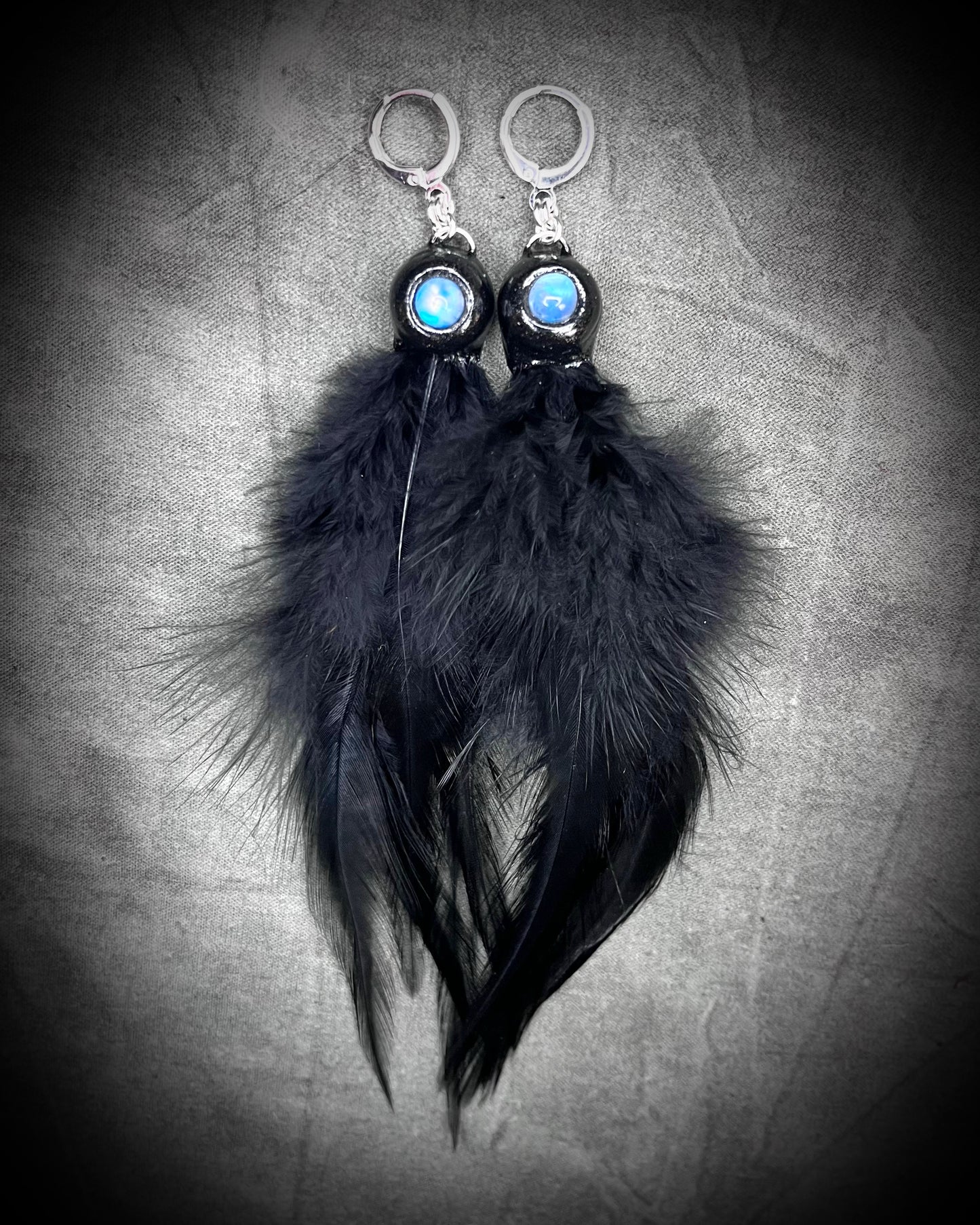 Mystical handmade black crystal earrings for her. Handmade black feather and moonstone dangle earrings on sterling silver hooks.