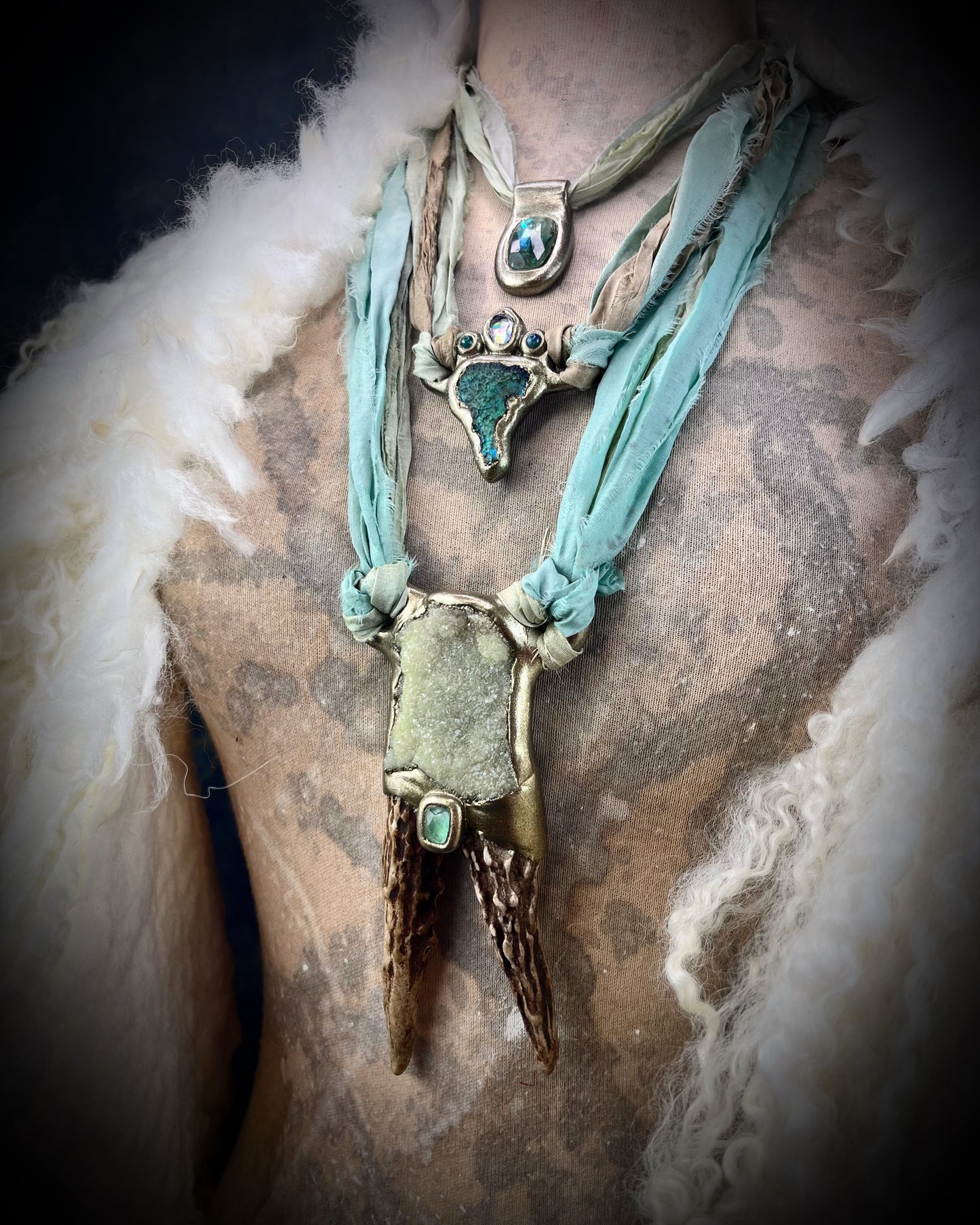Cosplay, fantasy movie set inspired, game of thrones handmade antler and prehnite crystal talisman hung from recycled silk. Be the Queen of Dragons with this bold and powerful necklace.