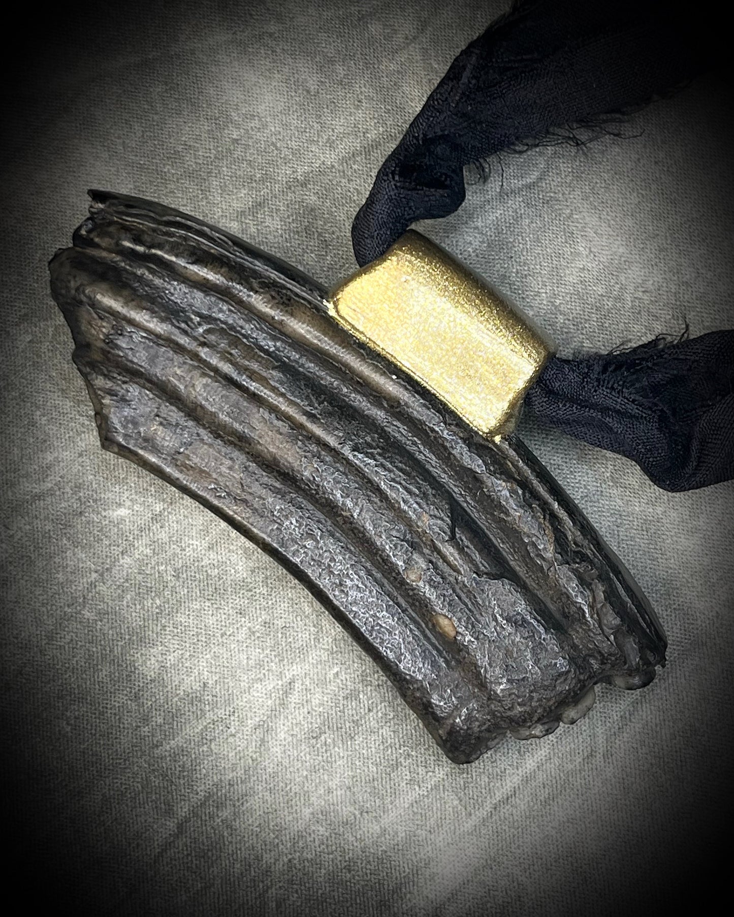 Equus fossil and chrysocolla talisman on black recycled silk, featuring ancient horse fossil material and blue-green chrysocolla, handmade by Become Spellbound in Baltimore, Maryland.