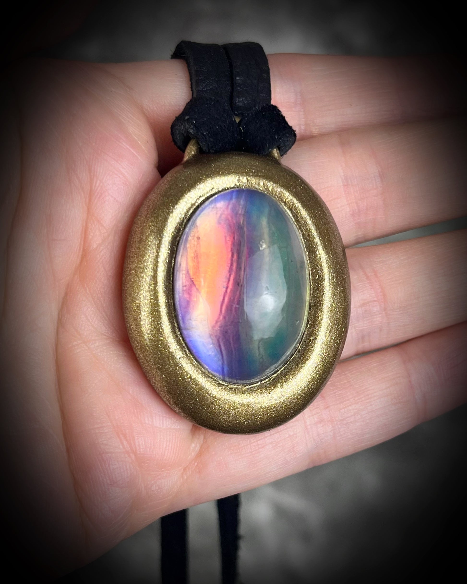 Fluorite cabochon oval necklaces in gold tone settings on black leather – mystical crystal jewelry for clarity, focus, and balance. Handmade gemstone pendant talismans, grounding and protective fluorite statement necklaces, perfect spiritual jewelry for daily wear, meditation, or gifting.