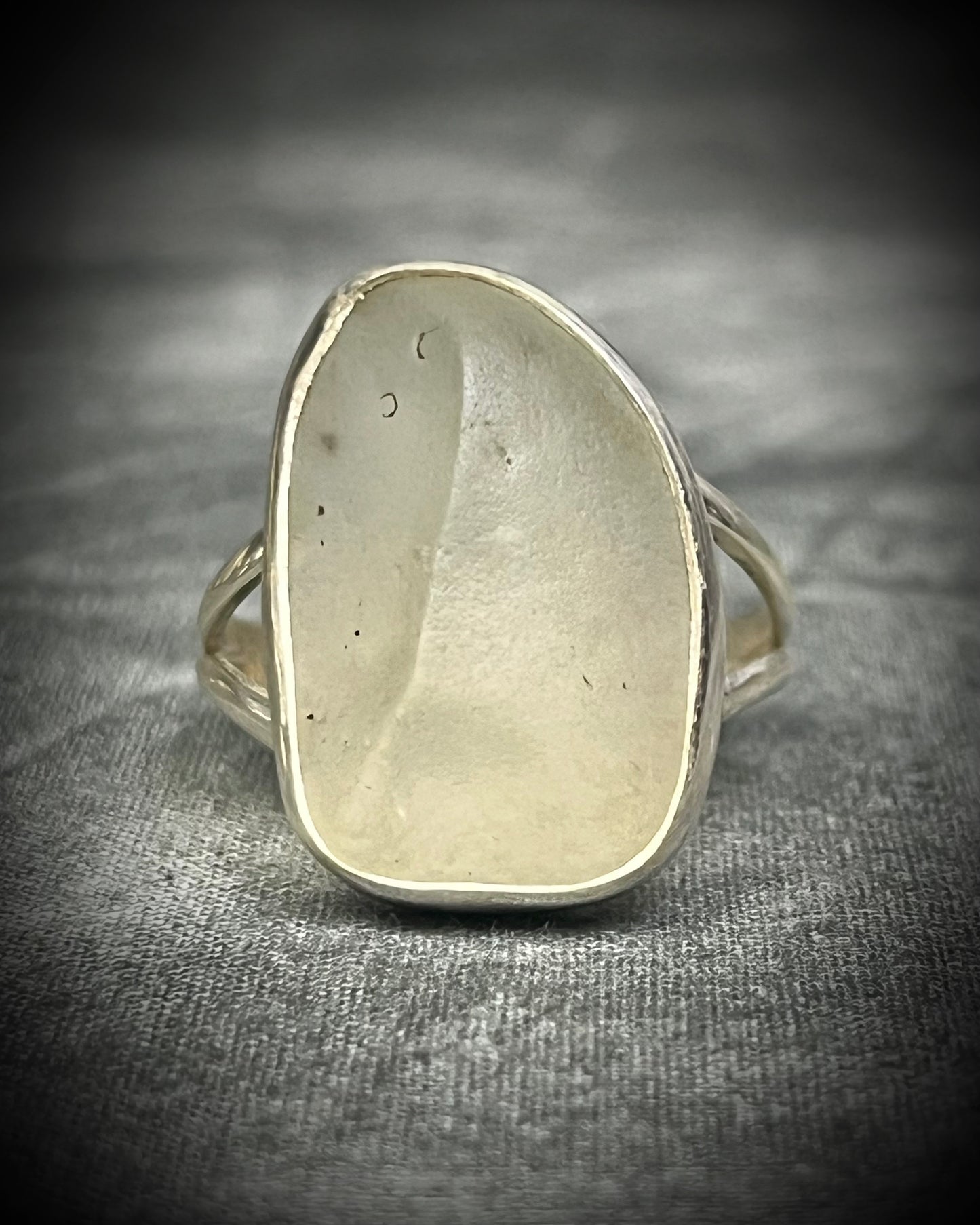 Genuine Libyan Desert Glass sterling silver ring featuring ancient impact glass with luminous golden tones. One of a kind by Become Spellbound, Baltimore Magazine Best of Baltimore 2026 Jewelry winner.