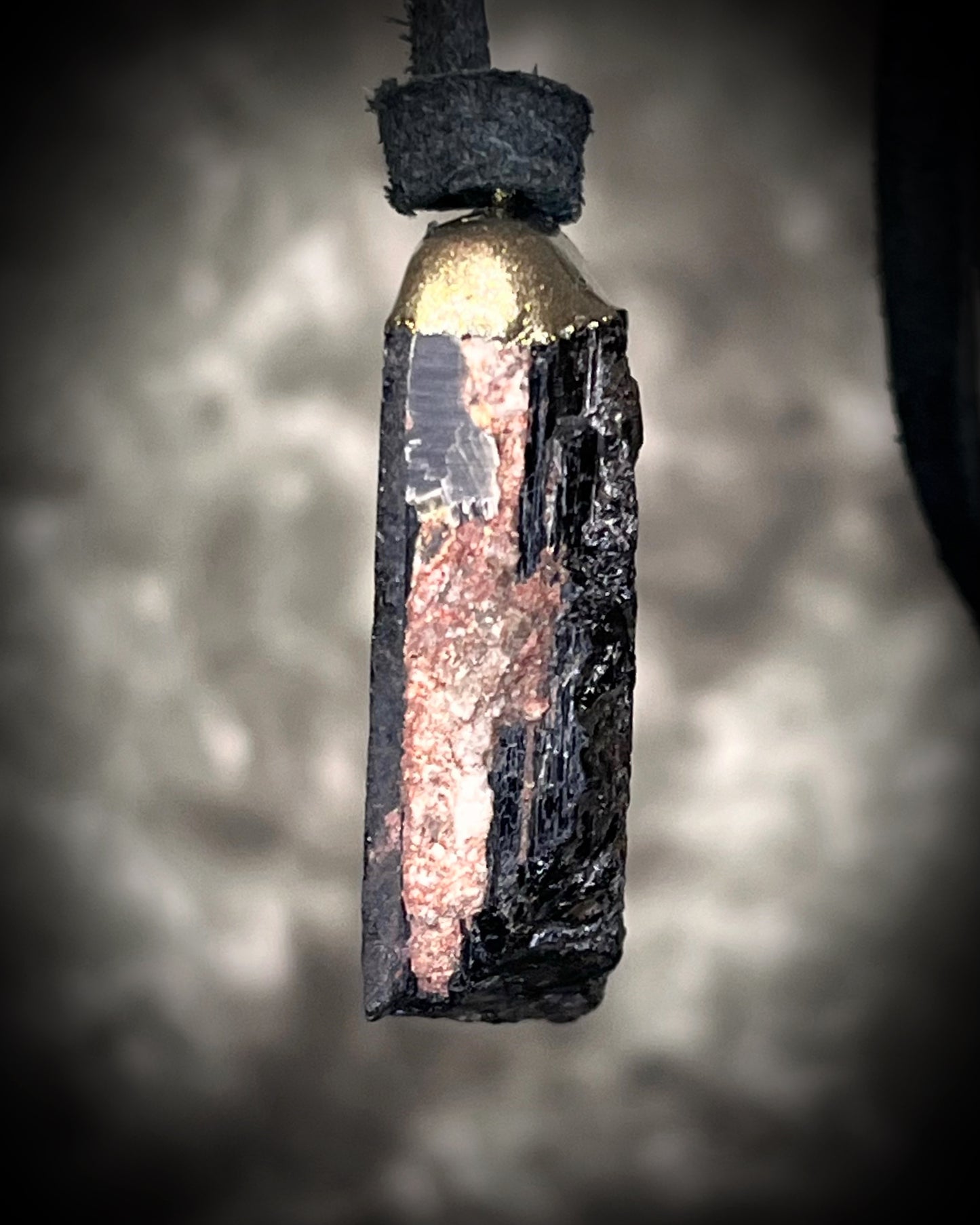 Gold finish, square shaped raw stone Black tourmaline grounding and protection pendant hung from black leather for an earthy adornment. Open back to touch skin and ground you.