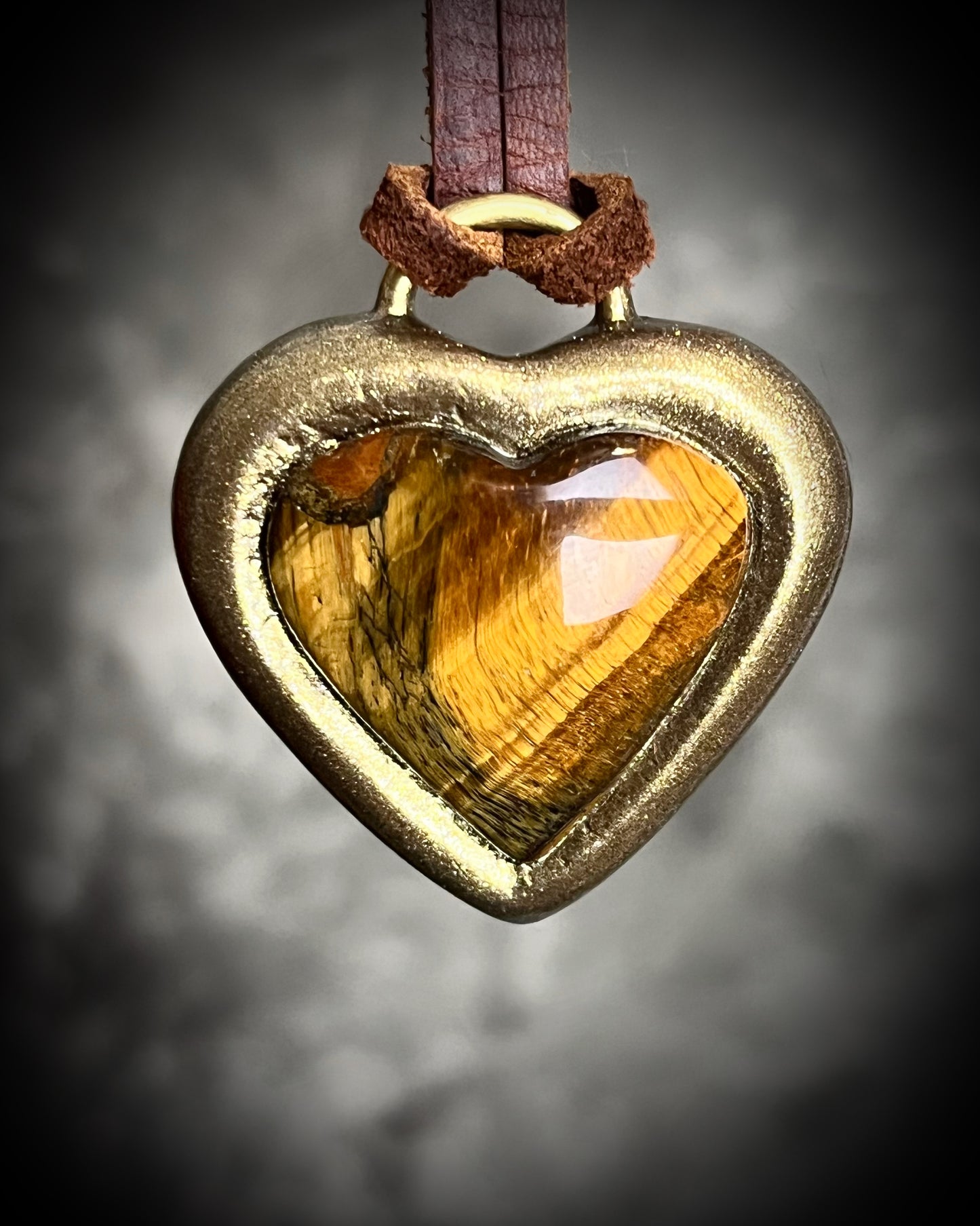 Tiger’s Eye crystal heart pendant necklaces with gold finish on brown leather cord — handmade grounding and protective jewelry. Holiday gift for her.