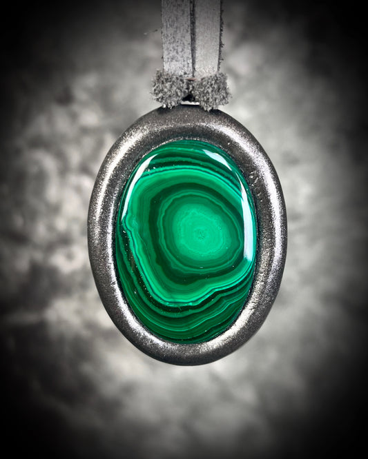 Malachite cabochon oval necklaces in gunmetal silvertone settings on grey leather – mystical crystal jewelry for heart chakra healing and protection. Handmade gemstone pendant talismans, grounding and protective malachite statement necklace-spiritual jewelry for daily wear, meditation, or gifting.