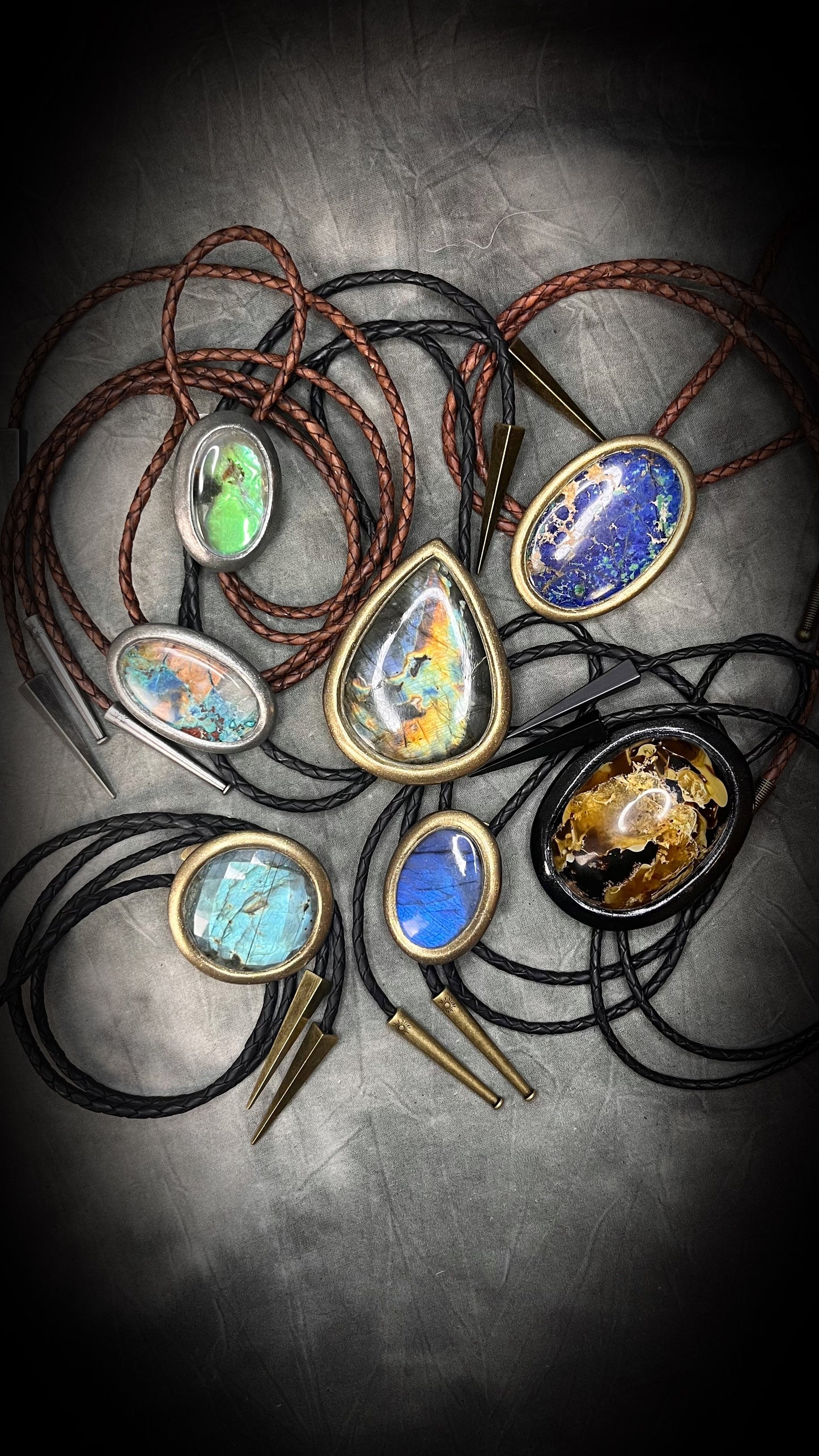 Many colorful Bolo Ties in a Gold and silver Finishes with Brass Spike Tips and black or brown leather. Statement Bolo Tie with Labradorite, Western and Witchy Bolo Tie Talismans.