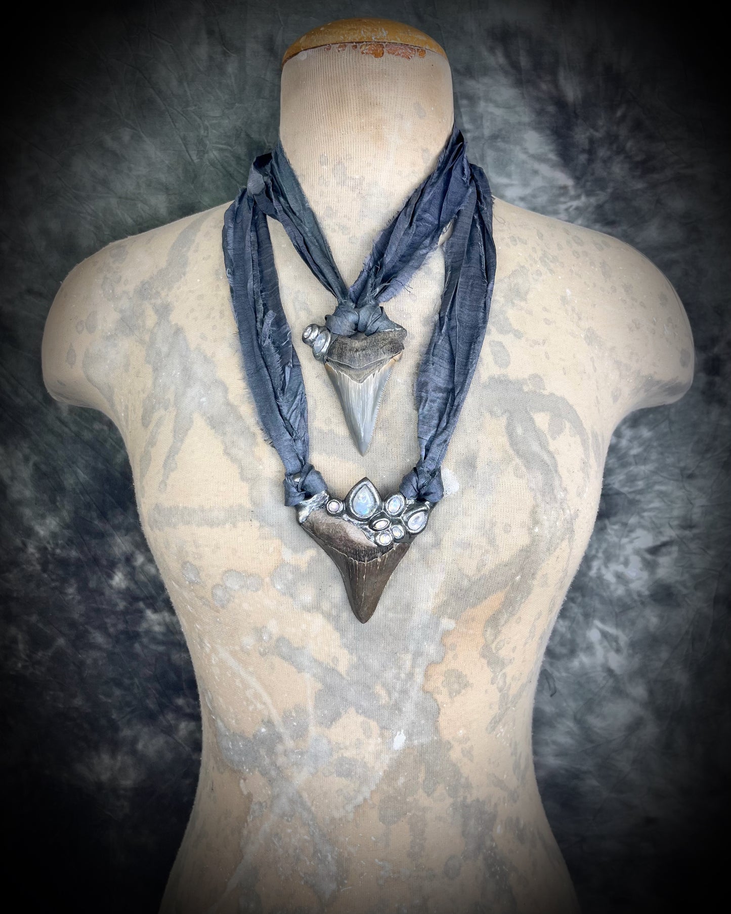 Megalodon shark tooth fossil handcrafted crystal talisman featuring rainbow moonstones in silver, hung from recycled slate gray silk. Beach wedding or beach photoshoot, cosplay, fantasy film costume or everyday enchantment!