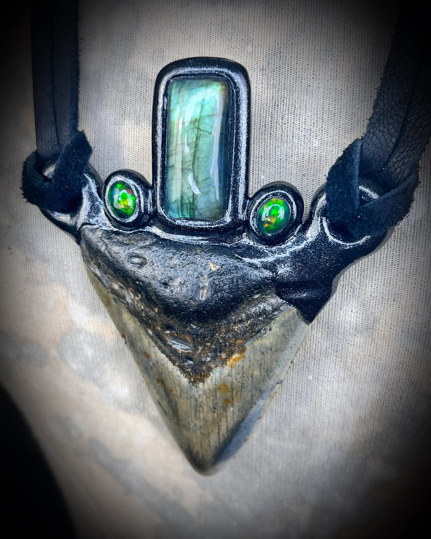 Museum level handmade genuuine Megalodon Fossil and crystal necklace with labradorite and black opals on leather. Unisex, powerful and one-of-a-kind magical jewelry.