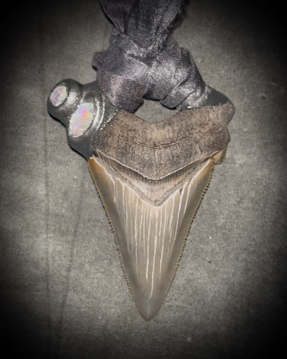Megalodon shark tooth fossil handcrafted crystal talisman featuring rainbow moonstones in silver, hung from recycled slate gray silk. Beach wedding or beach photoshoot, cosplay, fantasy film costume or everyday enchantment!