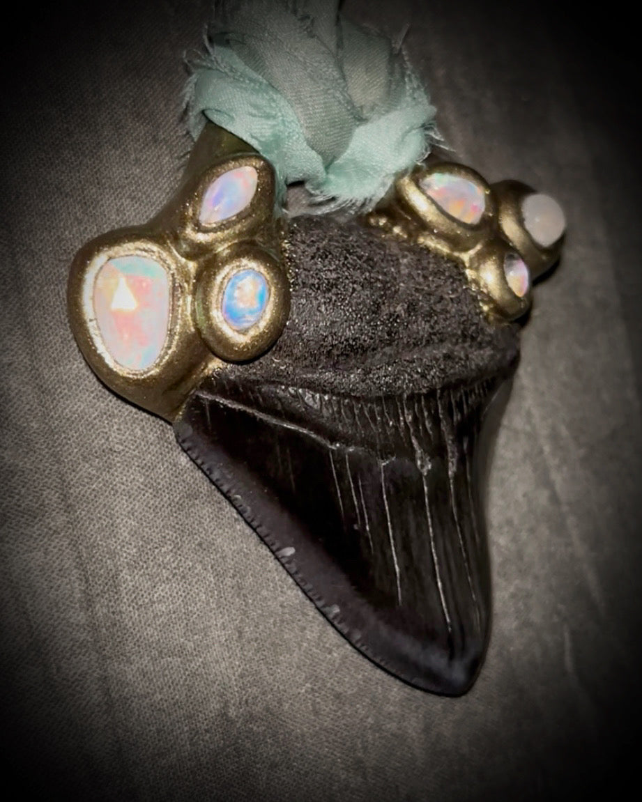 Megalodon shark tooth fossil handcrafted crystal talisman featuring opal gemstone and rainbow moonstones in gold, hung from recycled aqua silk. Beach wedding or summer jewelry photoshoot, cosplay, fantasy film costume or everyday enchantment!