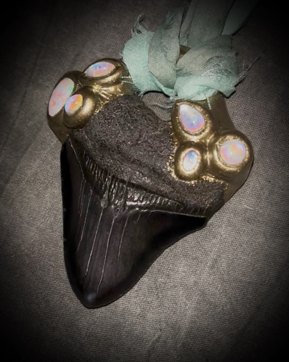 Megalodon shark tooth fossil handcrafted crystal talisman featuring opal gemstone and rainbow moonstones in gold, hung from recycled aqua silk. Beach wedding or summer jewelry photoshoot, cosplay, fantasy film costume or everyday enchantment!