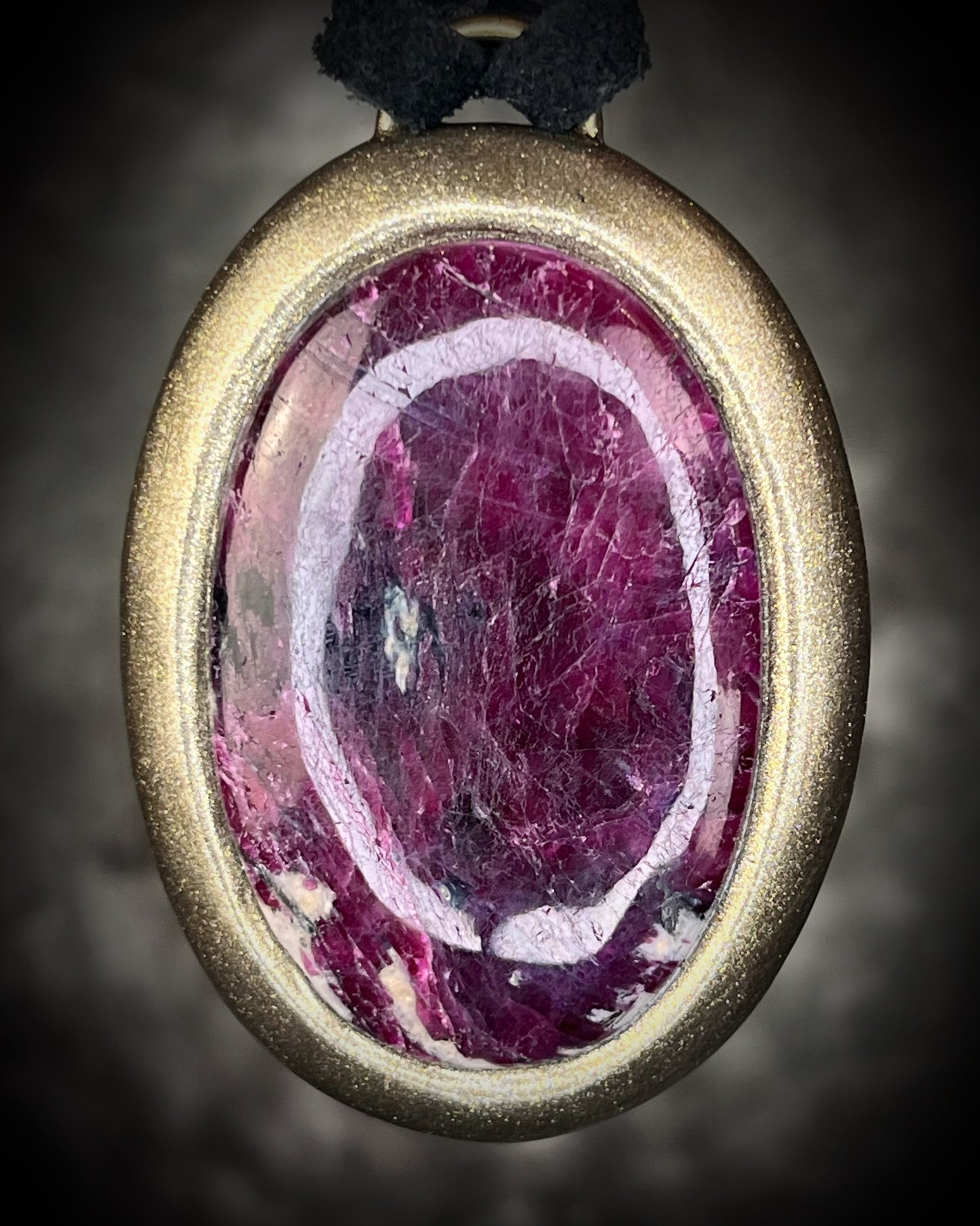 Natural Statement XL ruby birthstone necklace in gold finish. July birthstone gift for her. Large oval ruby handmade necklace on organic black leather.