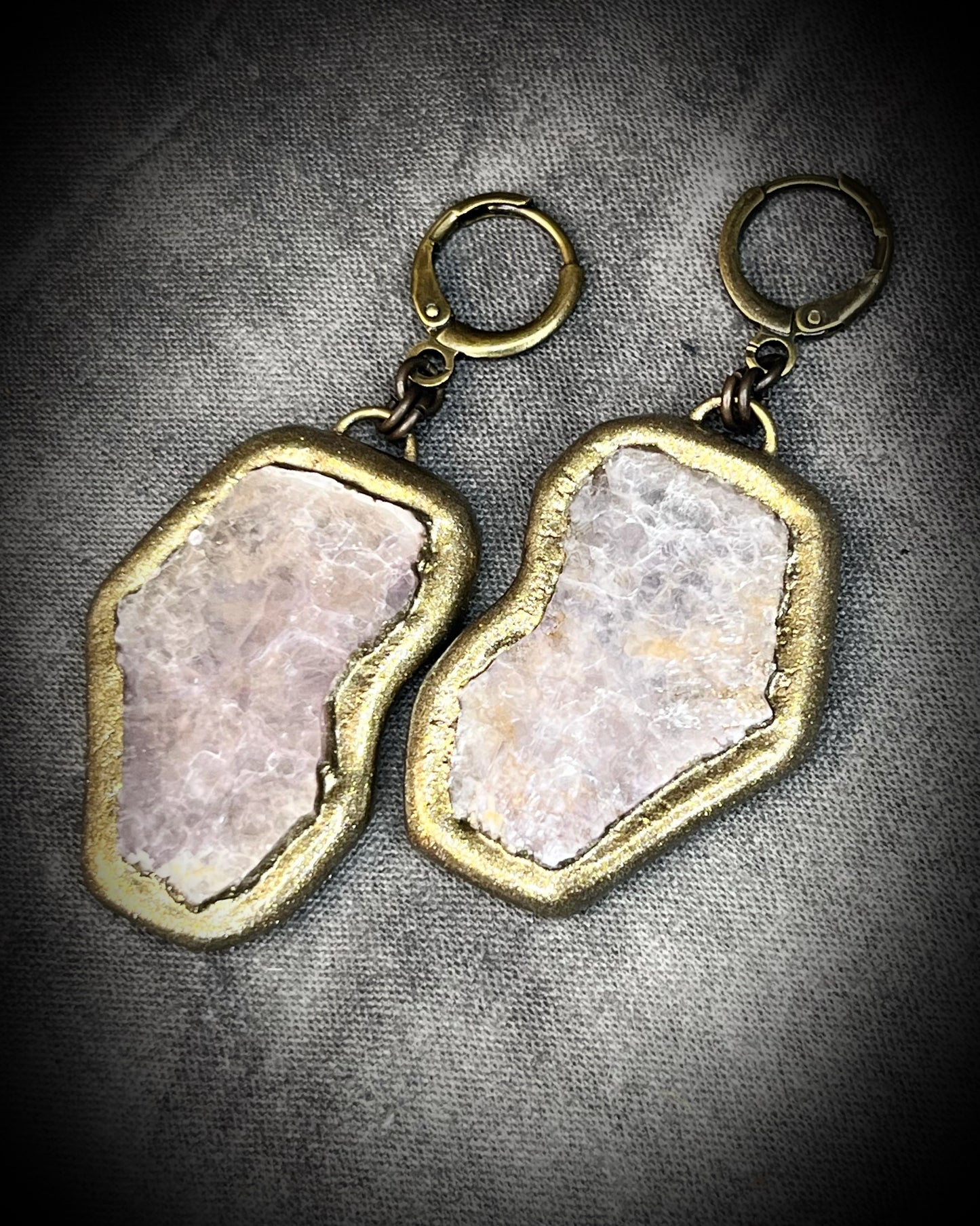 Pair of gold and lepidolite crystal anti-anxiety earrings with natural stone design on a gray background. Holiday handmade jewelry stocking stuffer gift for her!