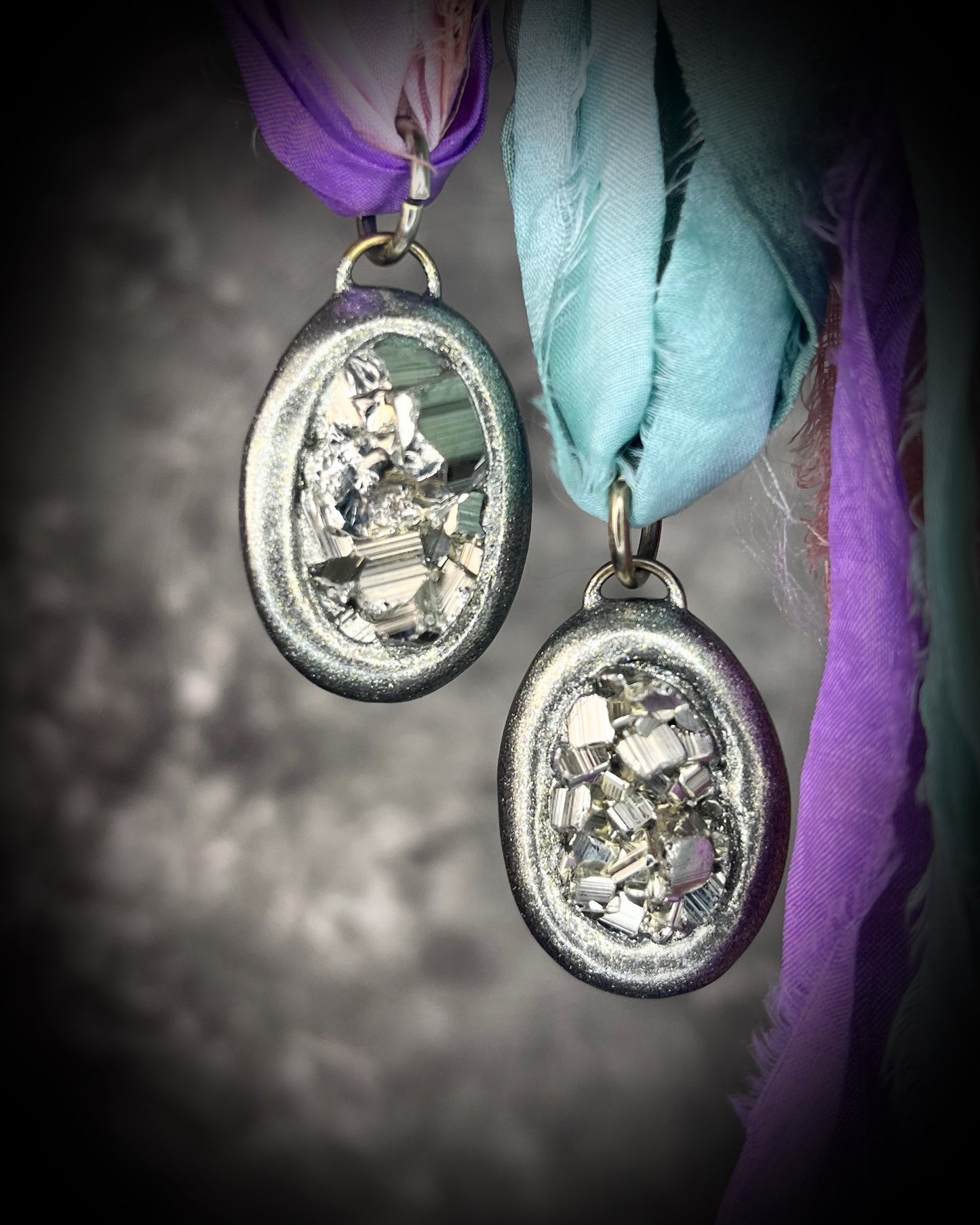 Pyrite crystal handmade necklaces on pink and purple recycled silk for boho summer adventures and manifesting magic! Car protection charm or purse charm. Best sustainable festival jewelry for summer adventures and eco-friendly parties