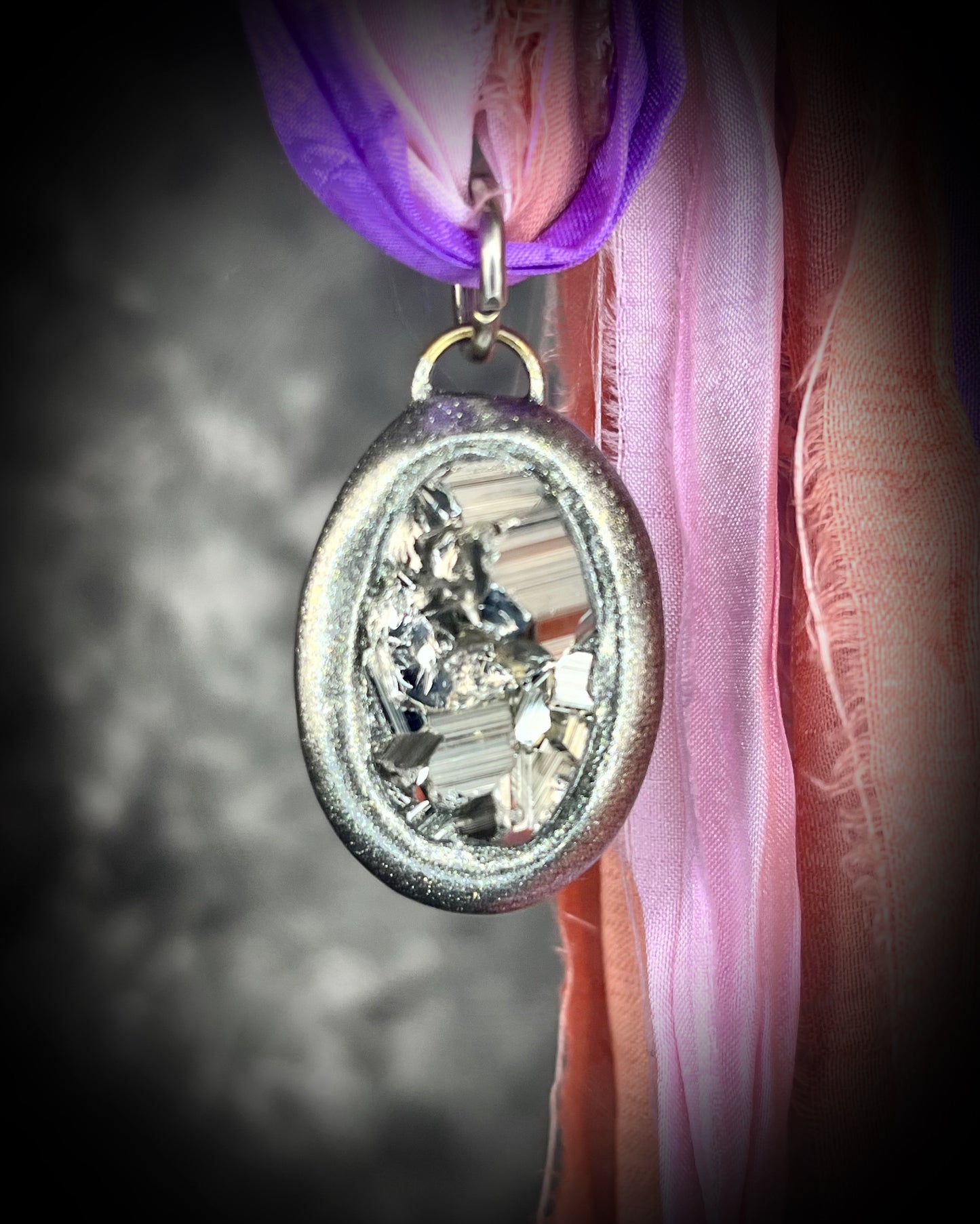 Pyrite crystal handmade necklaces on pink and purple recycled silk for boho summer adventures and manifesting magic! Car protection charm or purse charm. Best sustainable festival jewelry for summer adventures and eco-friendly parties