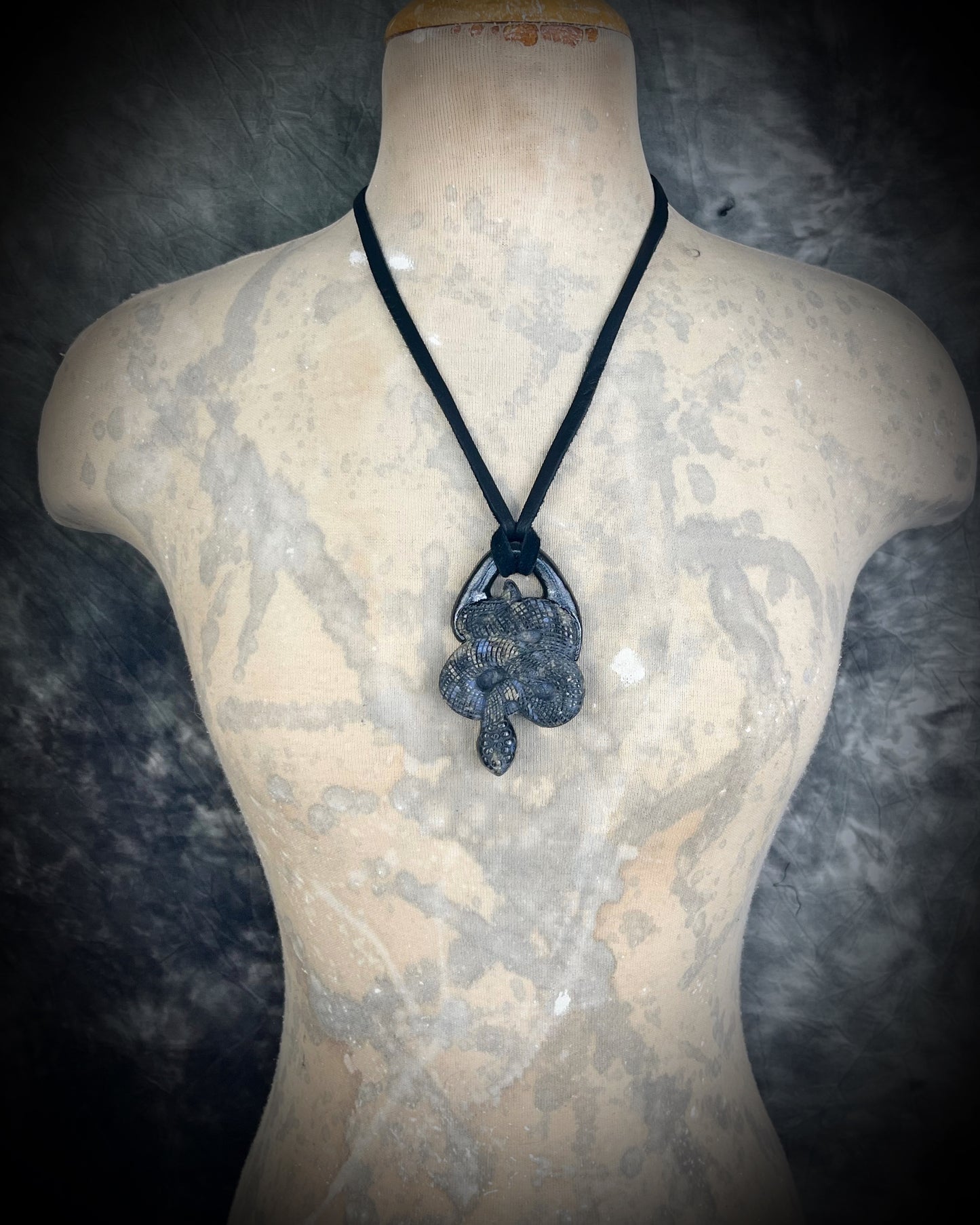 Que Sera crystal carved snake or serpent necklace for 2025 year of the snake. Handmade and hung from black leather for a mystical goddess.