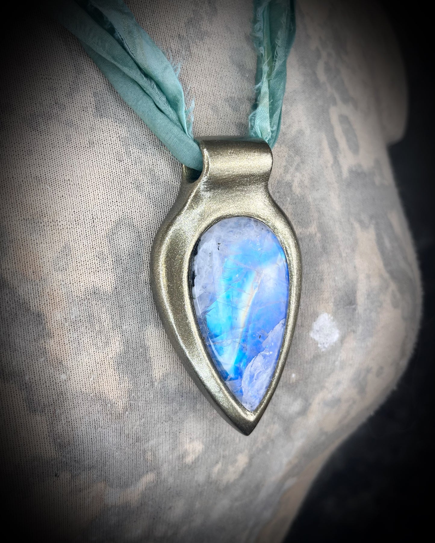 Handmade in the USA sculptural one of a kind statement, maximalist Rainbow Moonstone Necklace. Goddess inspired and hung from recycled silk for a modern eco-friendly gift!