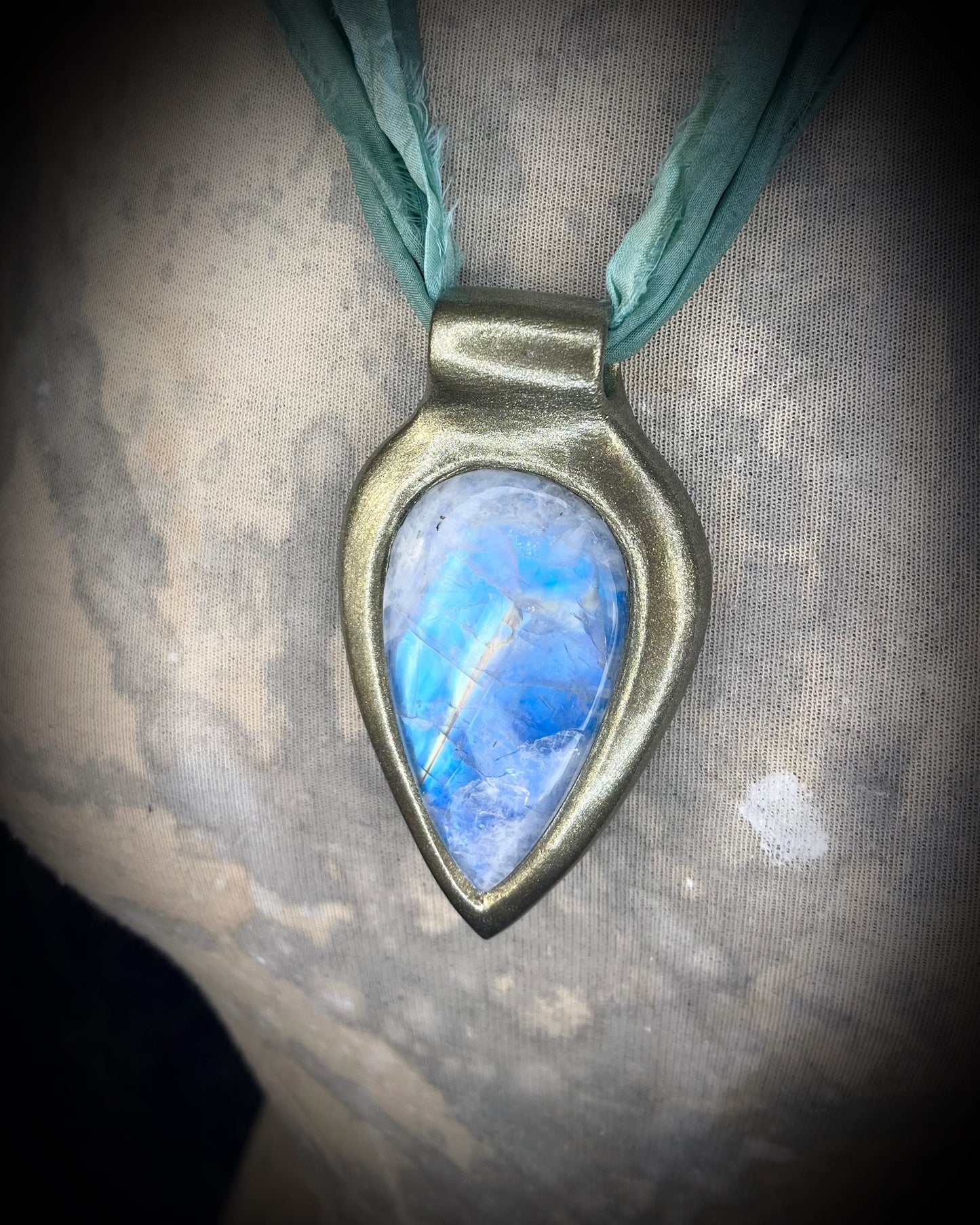 Handmade in the USA sculptural one of a kind statement, maximalist Rainbow Moonstone Necklace. Goddess inspired and hung from recycled silk for a modern eco-friendly gift!