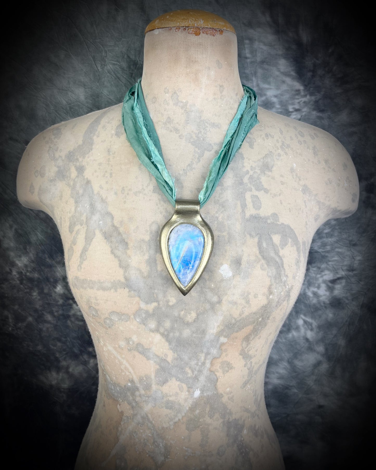 Handmade in the USA sculptural one of a kind statement, maximalist Rainbow Moonstone Necklace. Goddess inspired and hung from recycled silk for a modern eco-friendly gift!