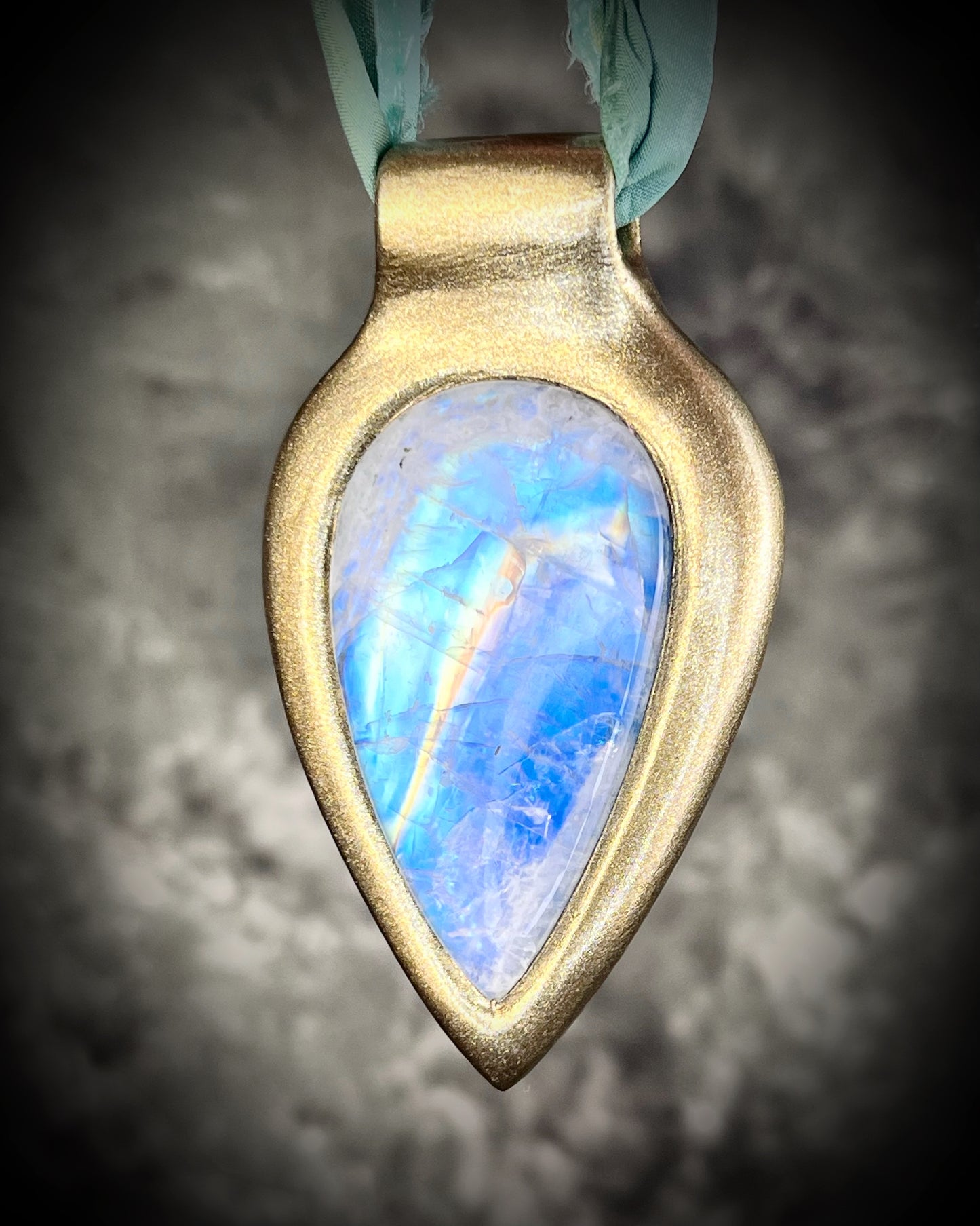 Handmade in the USA sculptural one of a kind statement, maximalist Rainbow Moonstone Necklace. Goddess inspired and hung from recycled silk for a modern eco-friendly gift!