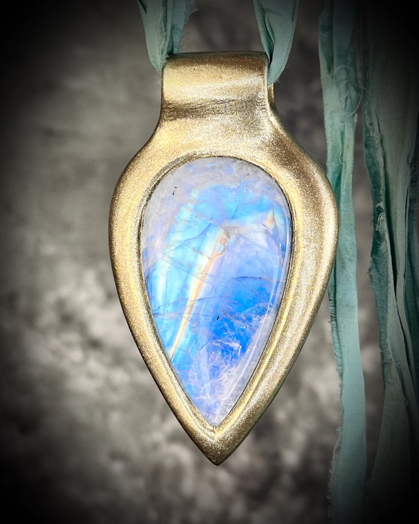 Handmade in the USA sculptural one of a kind statement, maximalist Rainbow Moonstone Necklace. Goddess inspired and hung from recycled silk for a modern eco-friendly gift!