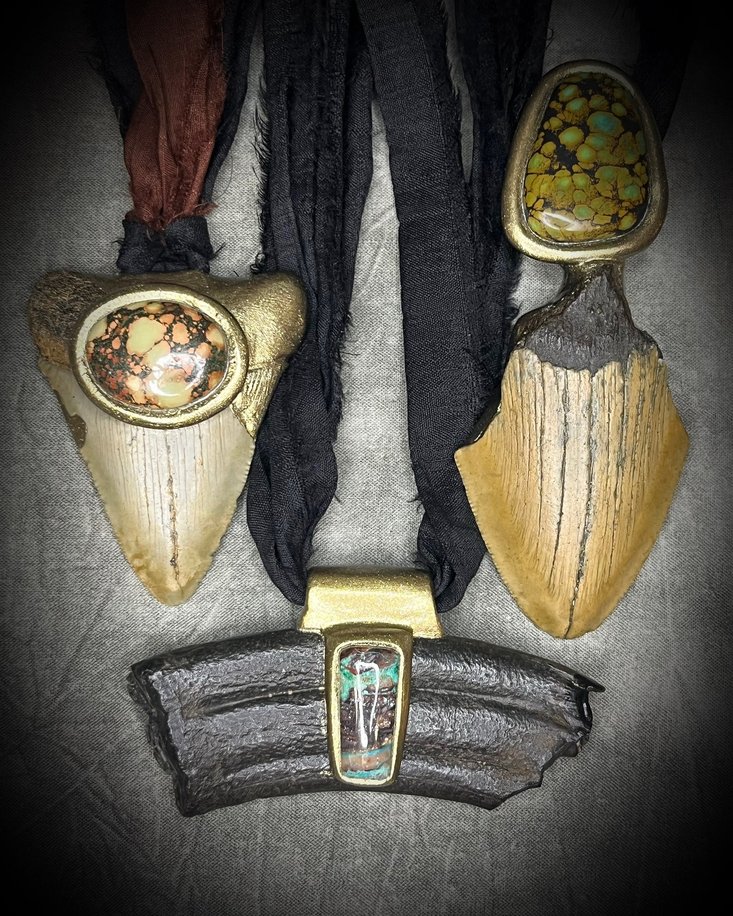 Megalodon fossil tooth talisman with sculptural turquoise in blue, moss green and mustard yellow, gold finish and black recycled silk.
