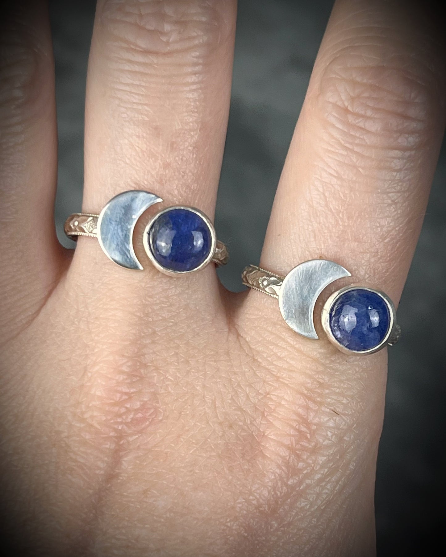 Tanzanite sterling silver moon ring with slightly adjustable band, celestial gemstone jewelry with violet blue stone for intuition and spiritual connection. Side view, band texture.