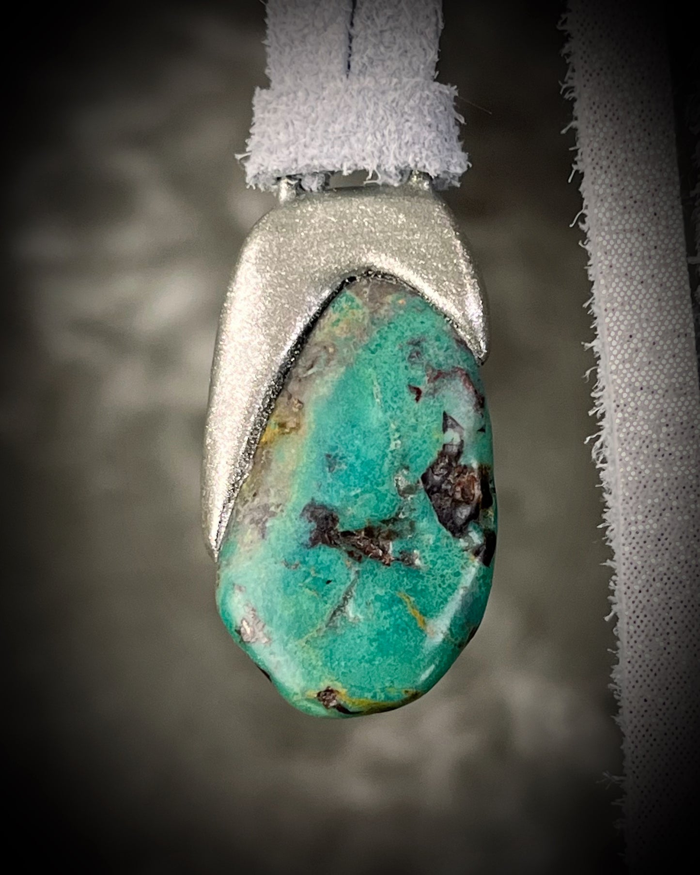 Turquoise stone pendant with silver setting hung on silver leather. Western boho jewelry gift for her.