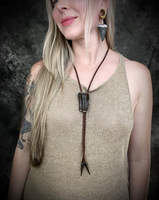 XL mako shark tooth fossil earrings in silver finish with sterling-plated huggie hooks, ocean-inspired statement fossil jewelry handmade in Baltimore Maryland. Worn here with Equus horse tooth fossil bolo tie.
