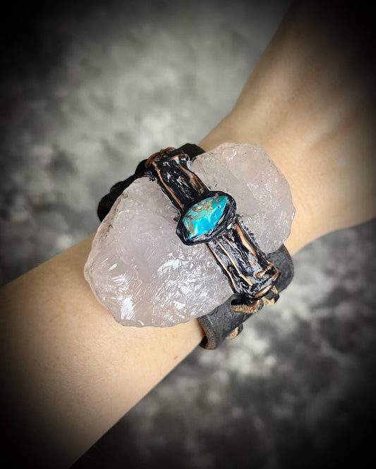 XL stitched leather cuff, handmade with a large raw Rose Quartz crystal paired with a Turquoise accent stone, and a tie-on leather cord closure for an adjustable, unisex fit.