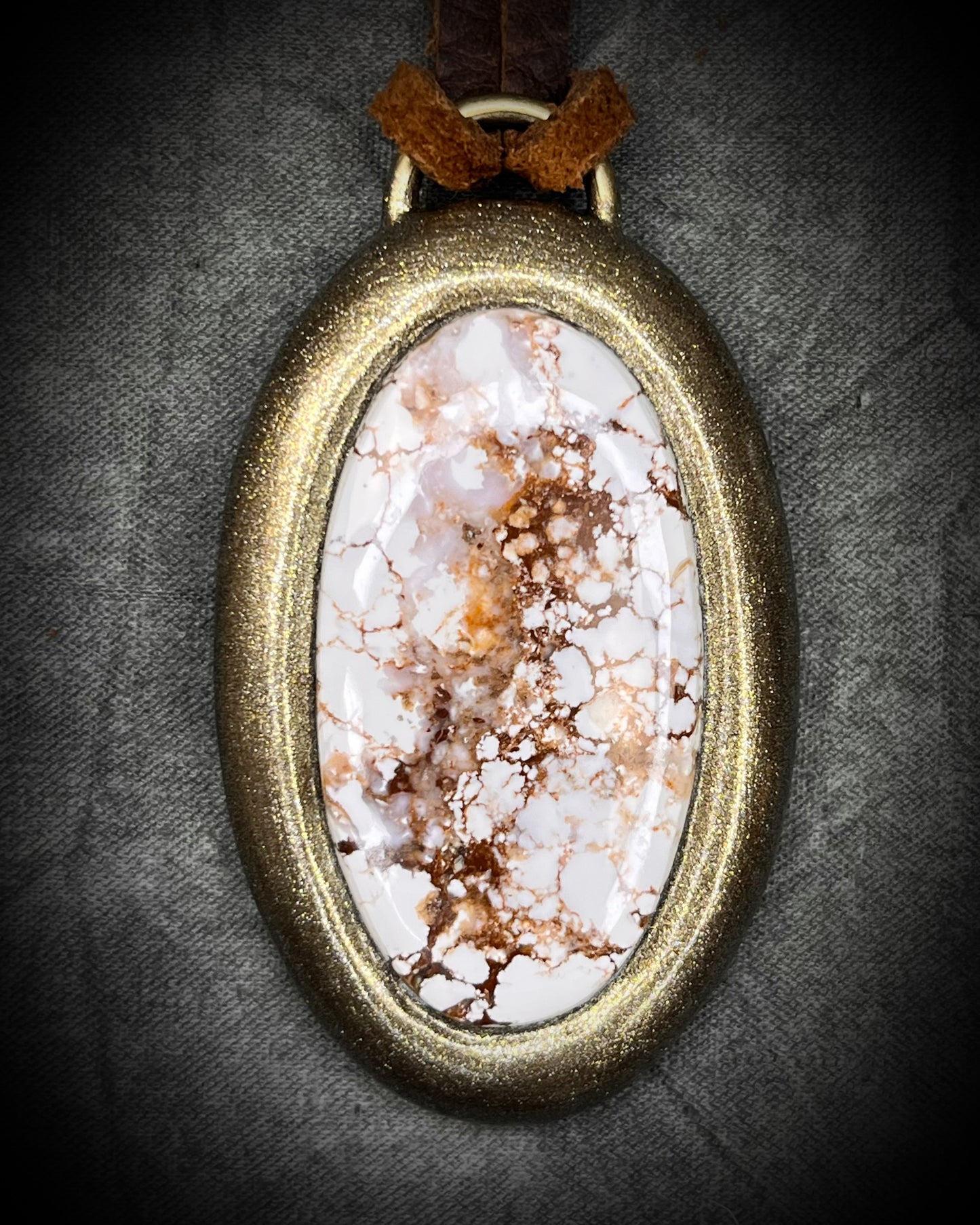 Year of the Horse inspired necklace featuring Wild Horse Magnesite crystal, in a gold setting and hung from earthy brown leather. Talisman for wild hearts and boho western fashion.