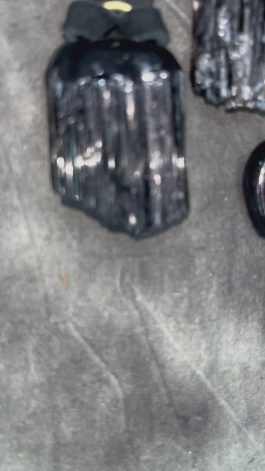 Skull-shaped pendant with a yellow fire citrine teardrop shaped gemstone on a dark background. Halloween jewelry for her, gothic jewelry gift for her.