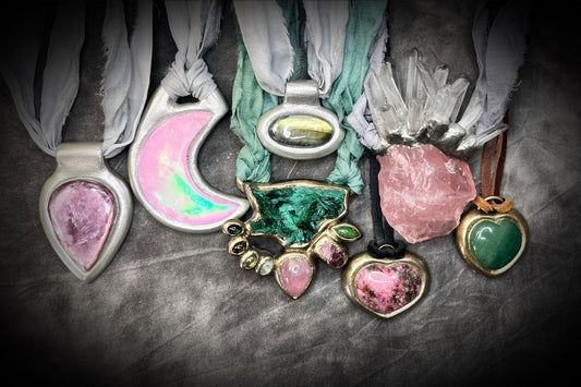 Power From The Heart: Why This Collection Exists Now in 2026- image of various crystal healing heart chakra necklaces in greens and pinks.