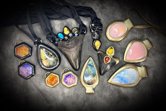 An array of crystal necklaces for Libra season featuring citrine, amethyst, labradorite, moonstone and rose quartz.