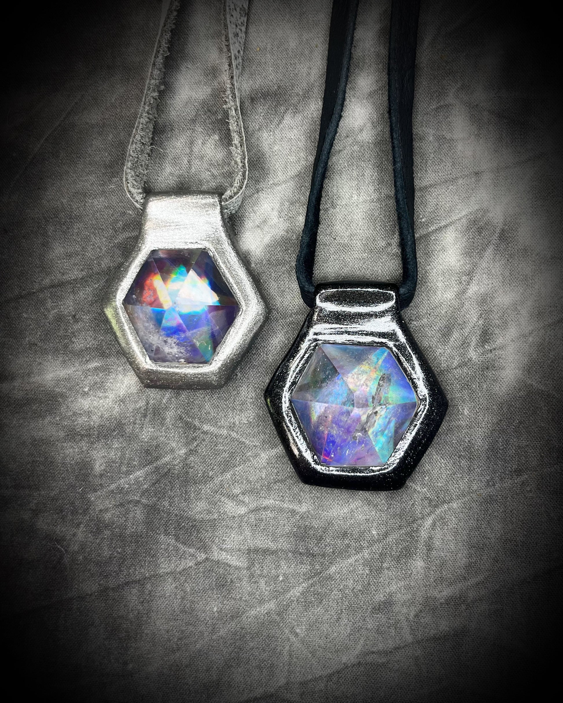 Stacked silver and Black David Bowie inspired designer quartz black rainbow necklaces. On silver and black leather adjustable & customizable from choker to pendant. 