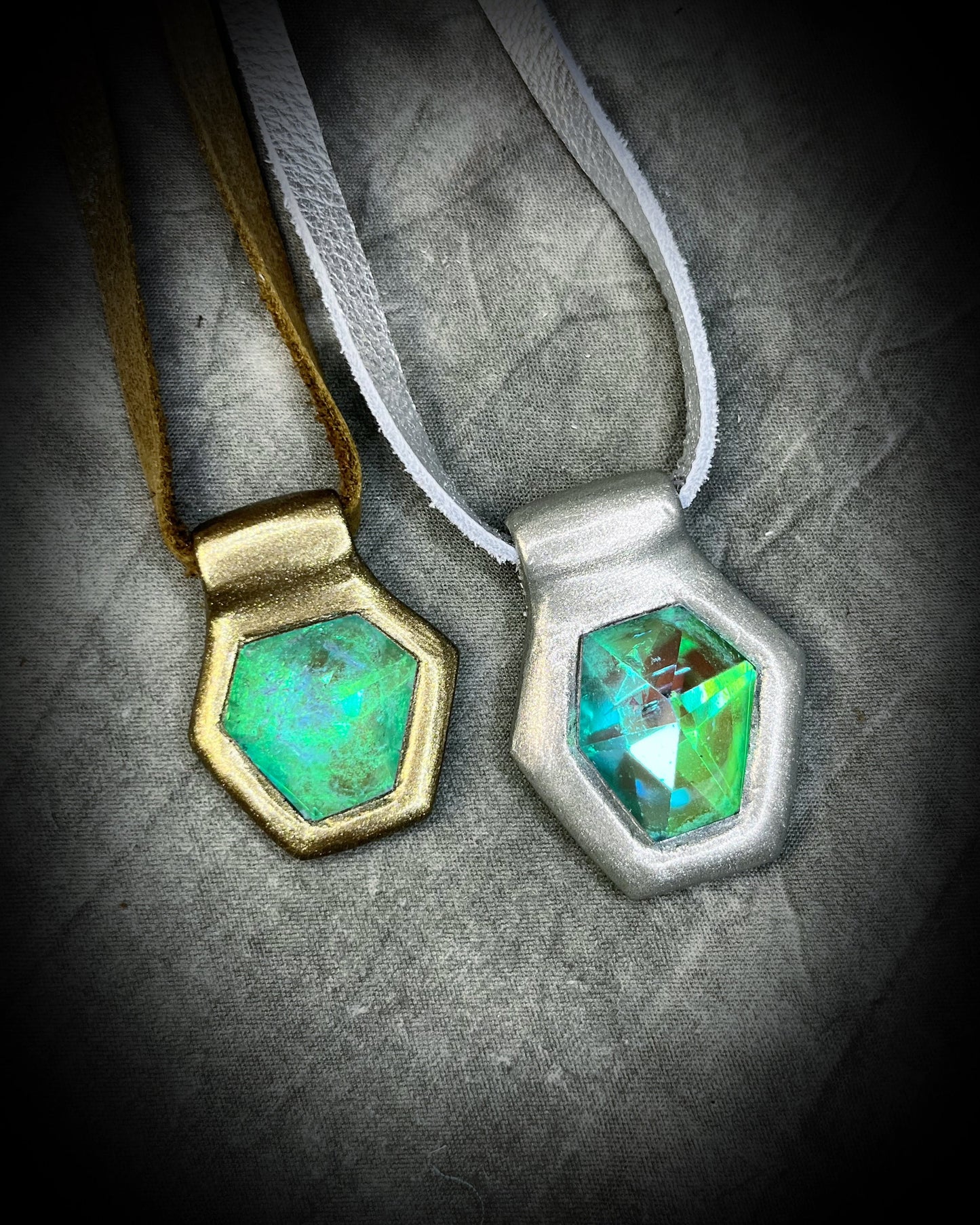 Handmade designer aqua turquoise opalescent quartz gemstone pendants in a gold and silver finish.  These crystal healing necklaces are personalized jewelry and are customizable on leather or recycled silk for the sustainable and eco-friendly jewelry lover or mermaid.