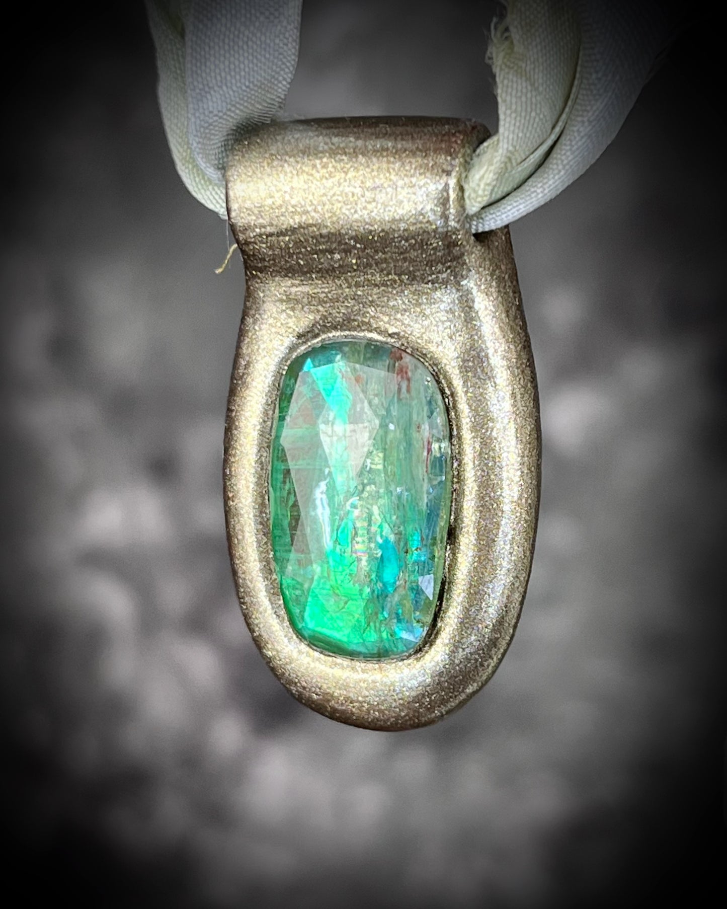 Green kyanite gemstone faceted crystal healing heart chakra pendant on recycled silk.  Best travel jewelry for summer, festival or wedding!