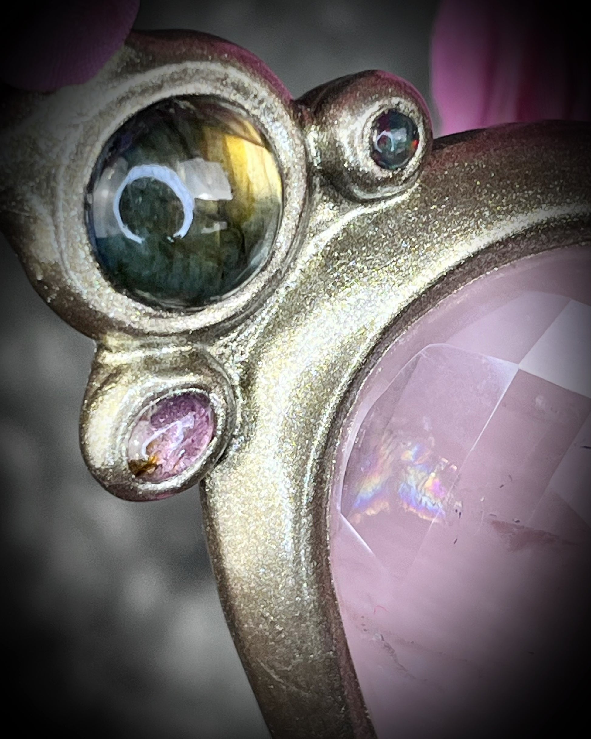 Statement Maximalist goddess collar featuring large faceted Rose Quartz Crystal, two glowing labradorite gemstones, pink tourmaline and black opals.  Bold jewelry for a big impact!