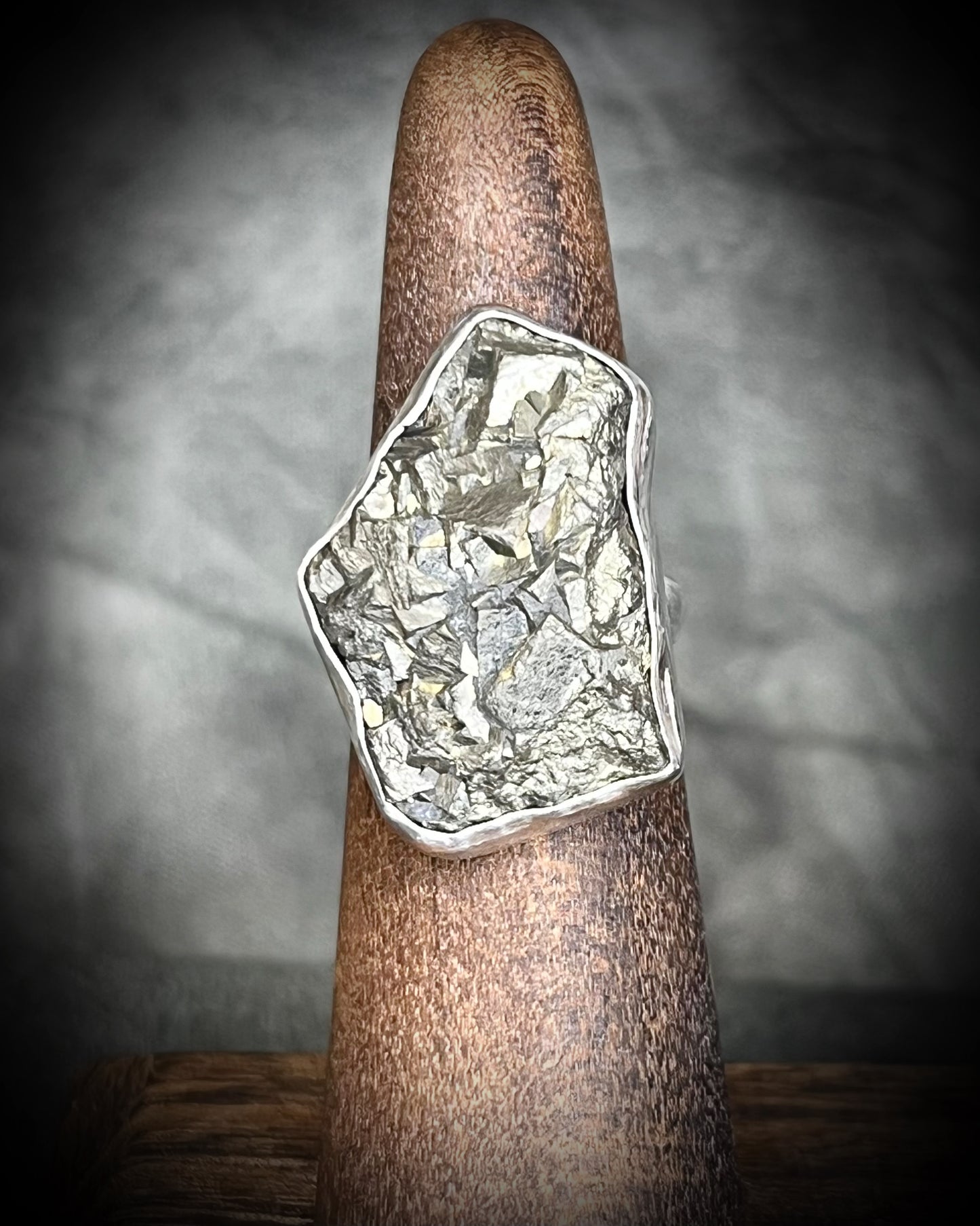 A sterling silver statement cocktail ring featuring a dazzling pyrite crystal.  Manifest your dreams and protect your energy with style.